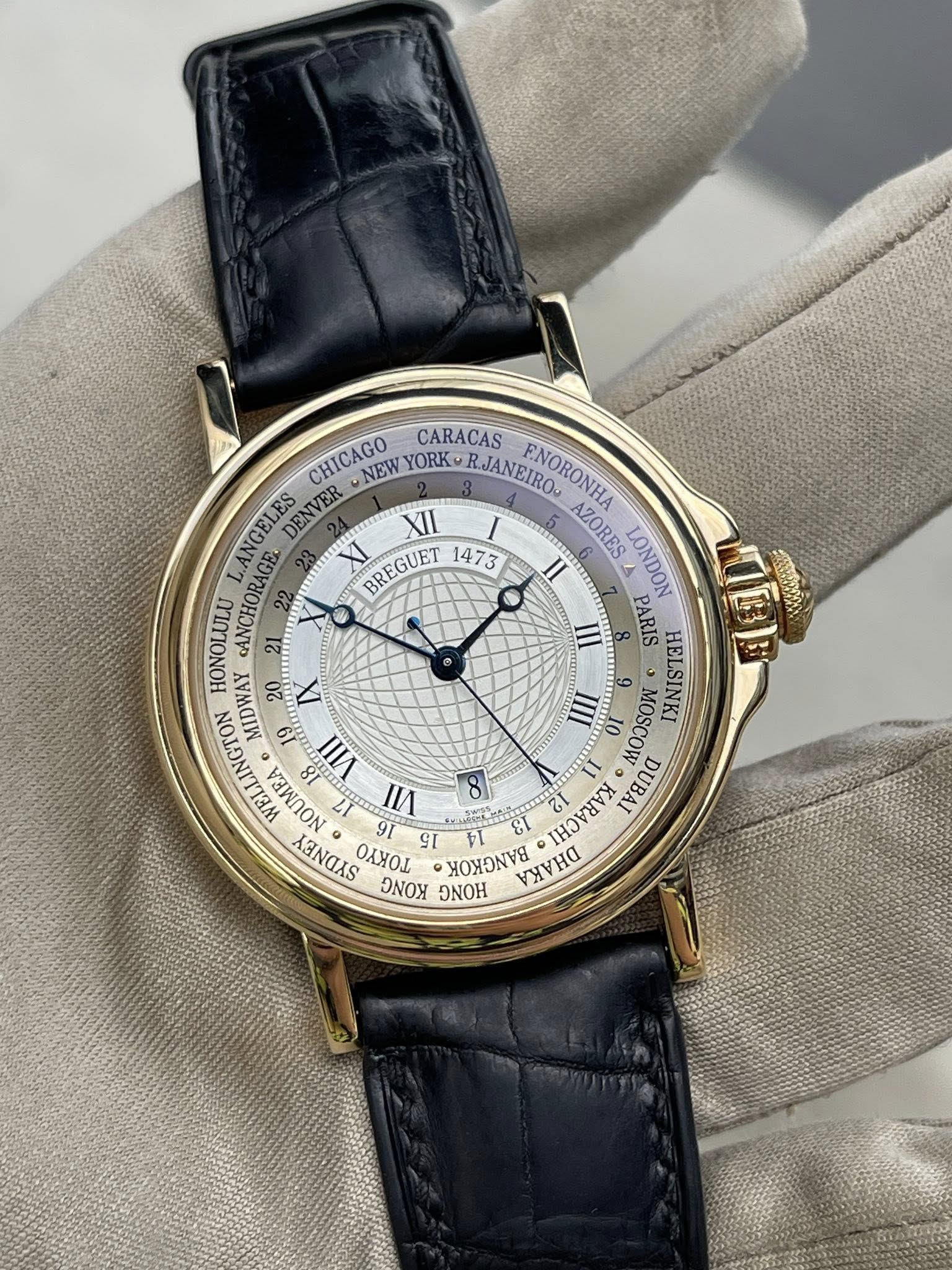 May be an image of wrist watch and text