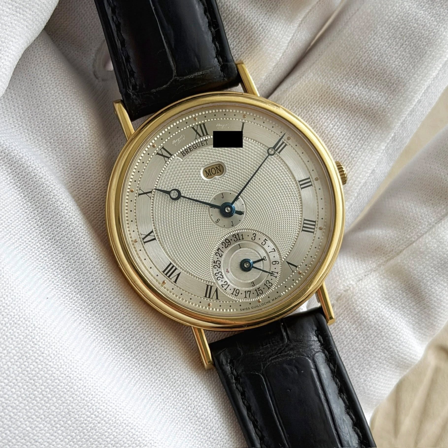 May be an image of wrist watch and text