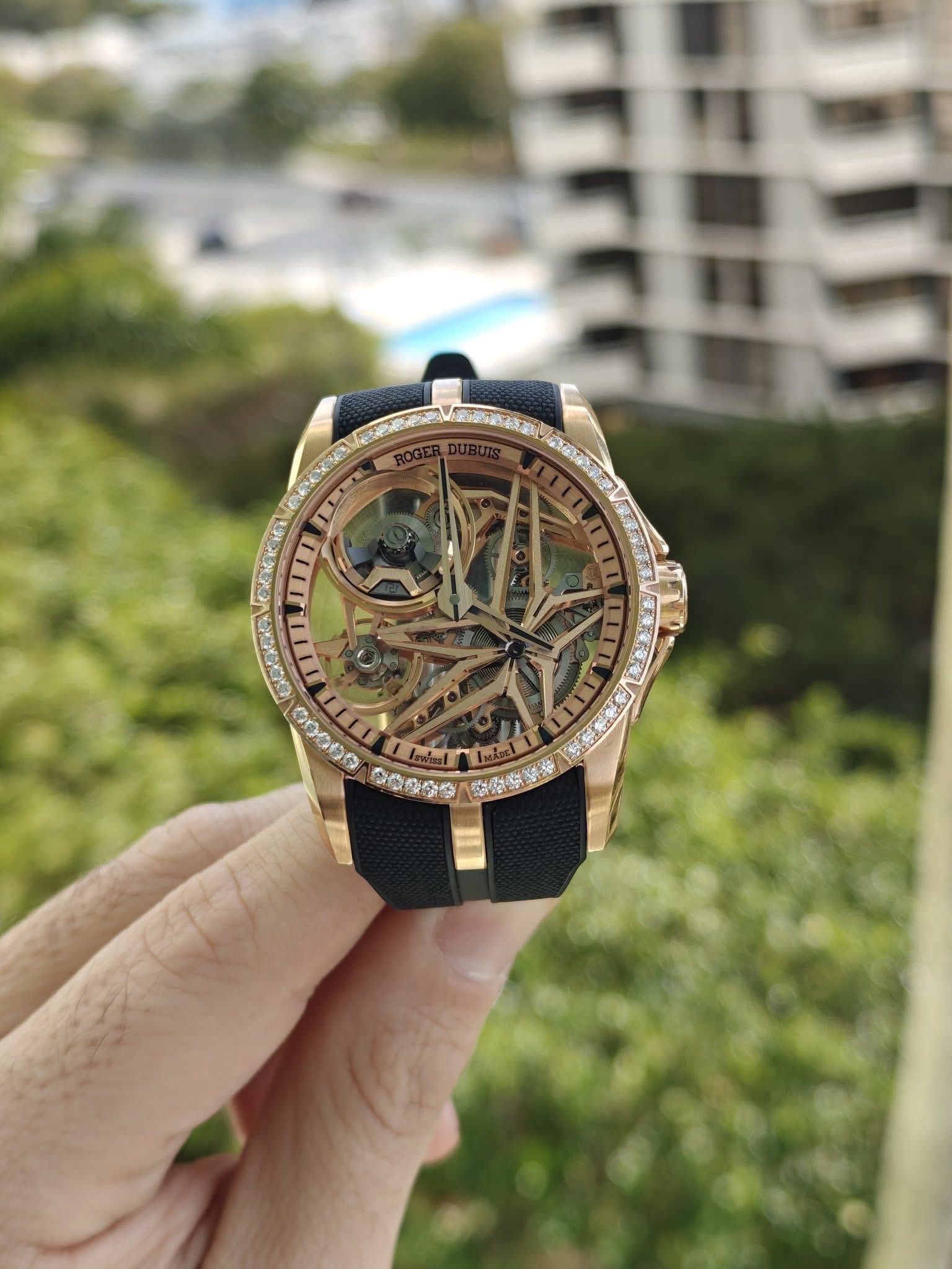 May be an image of wrist watch and text
