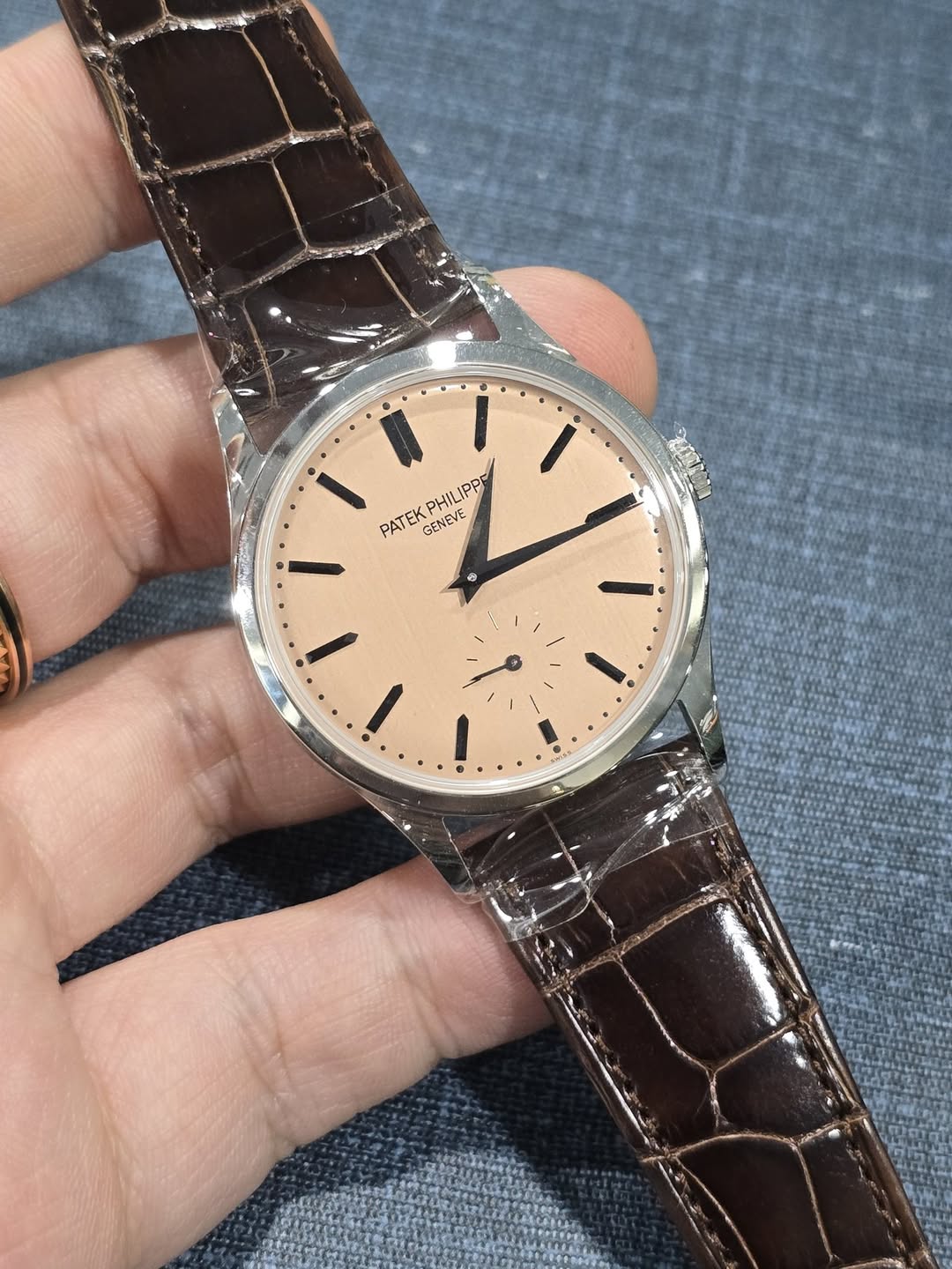 May be an image of wrist watch and text that says 'PHILIPPE PPP PATEK GENEVE F I I'