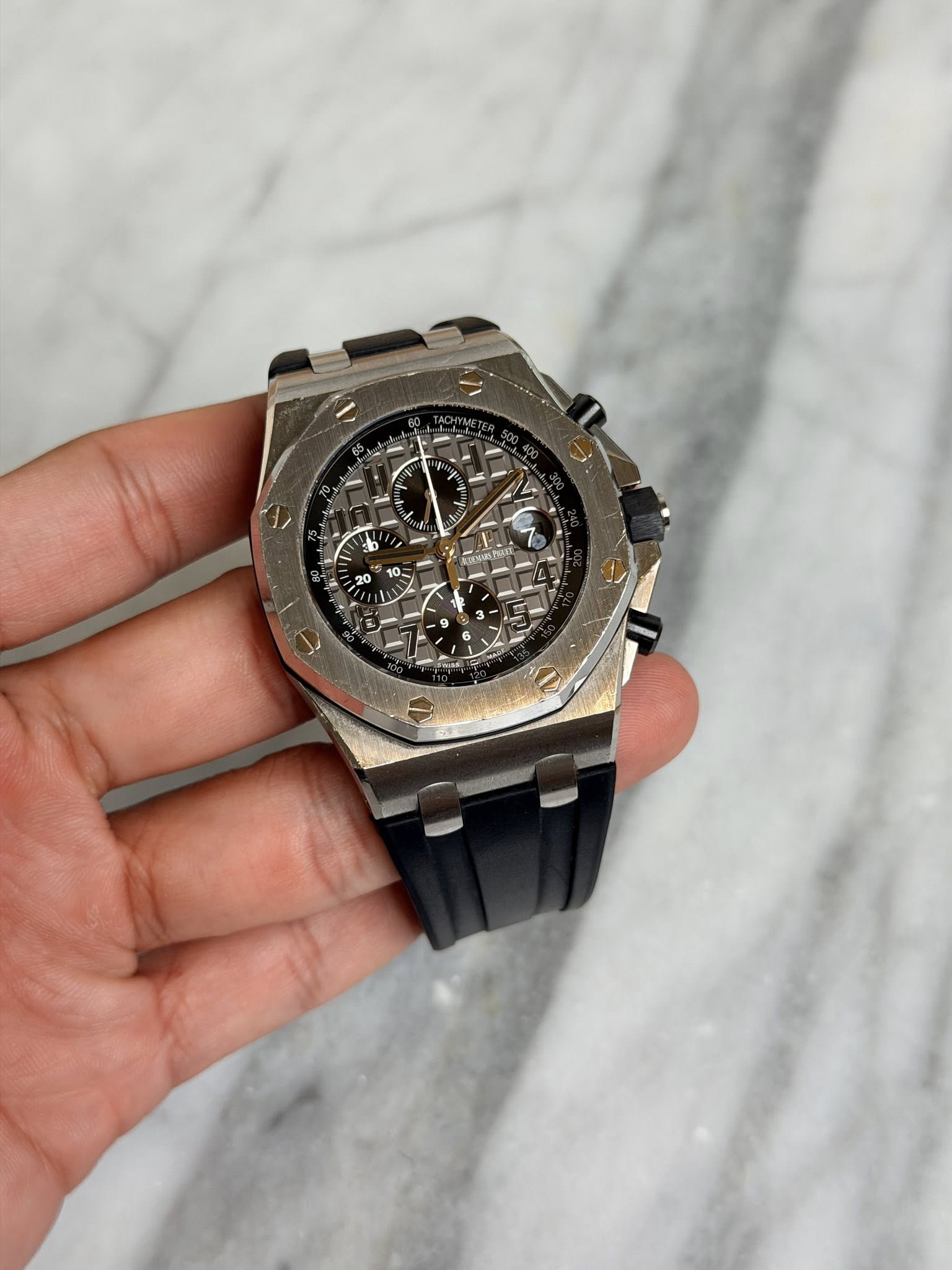 May be an image of wrist watch and text