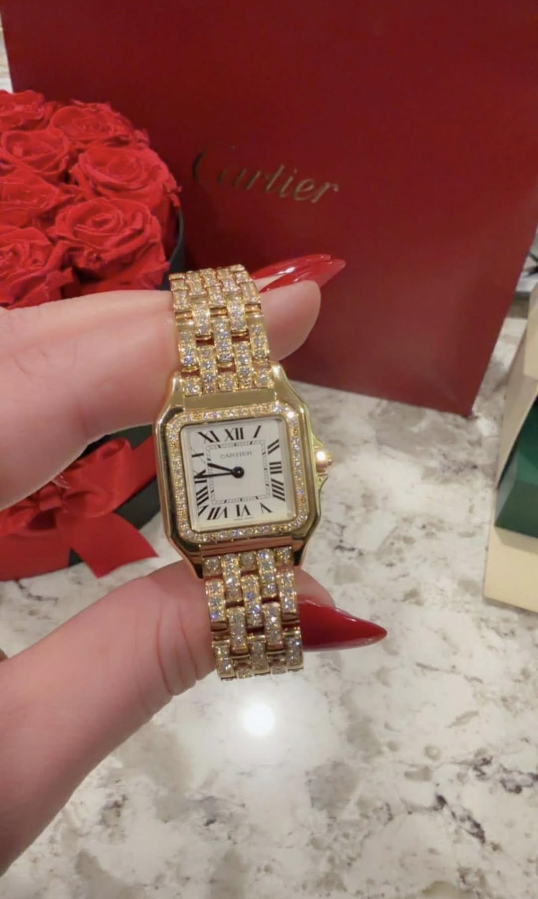 May be an image of wrist watch and text that says 'XI XII XII CARTIEN II|/1 11I I HAIAN IA //1'