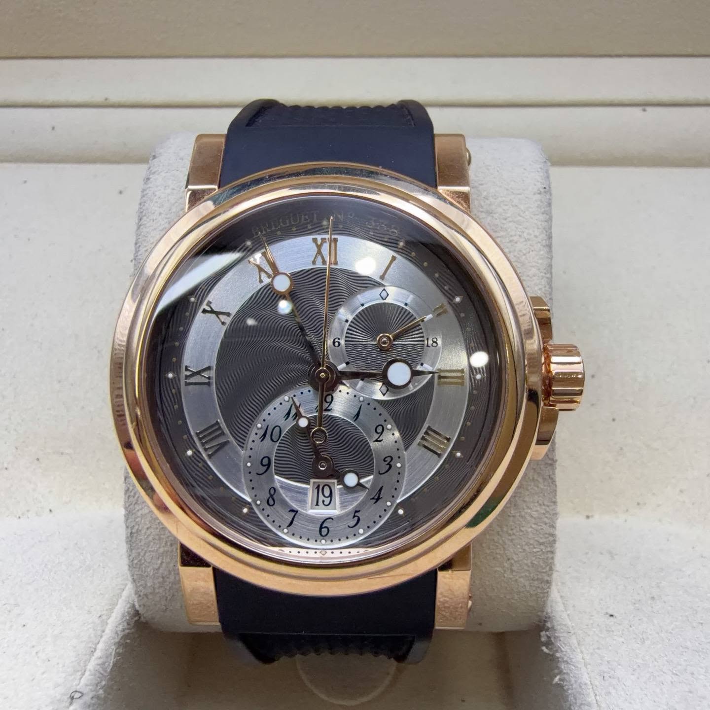 May be an image of wrist watch and text