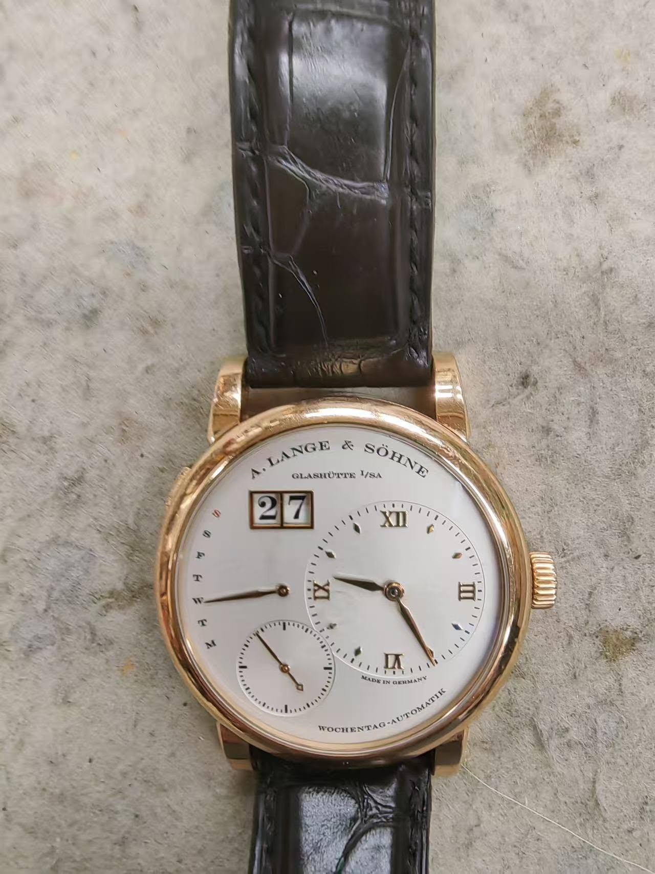 May be an image of wrist watch and text