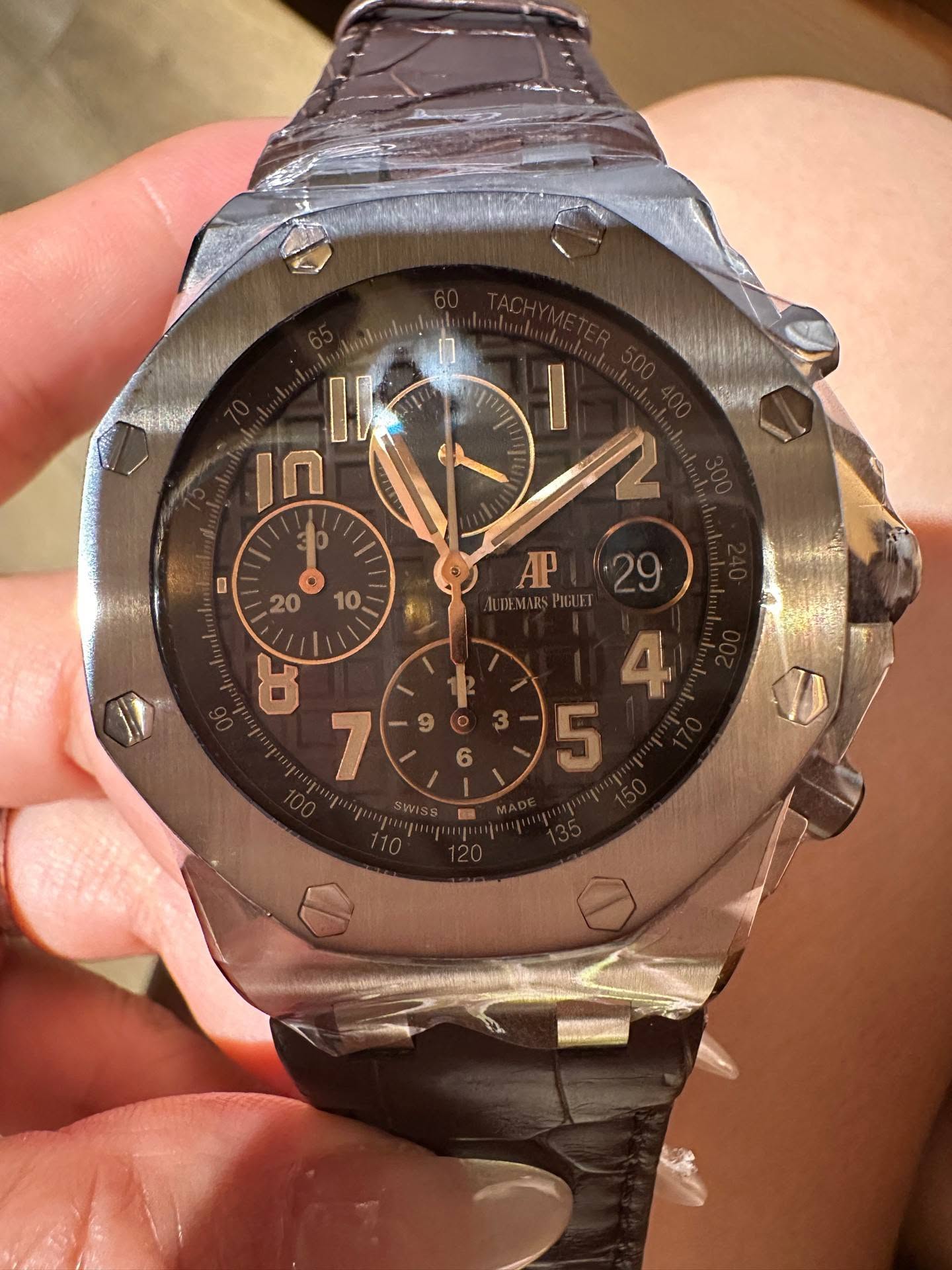 May be an image of wrist watch and text