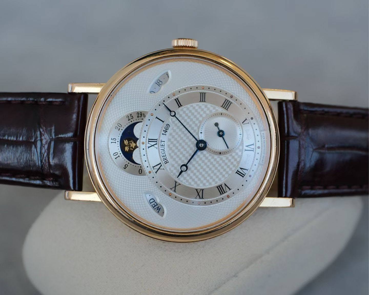 May be an image of wrist watch and text