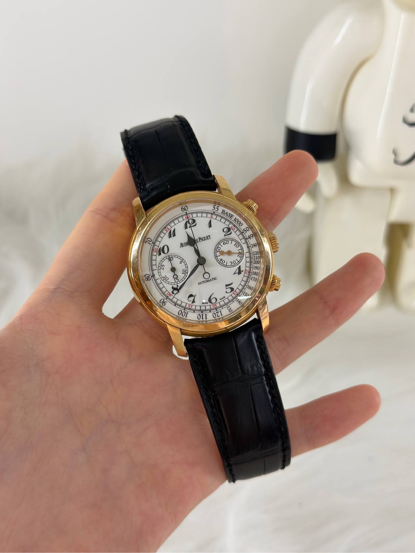 May be an image of wrist watch and text