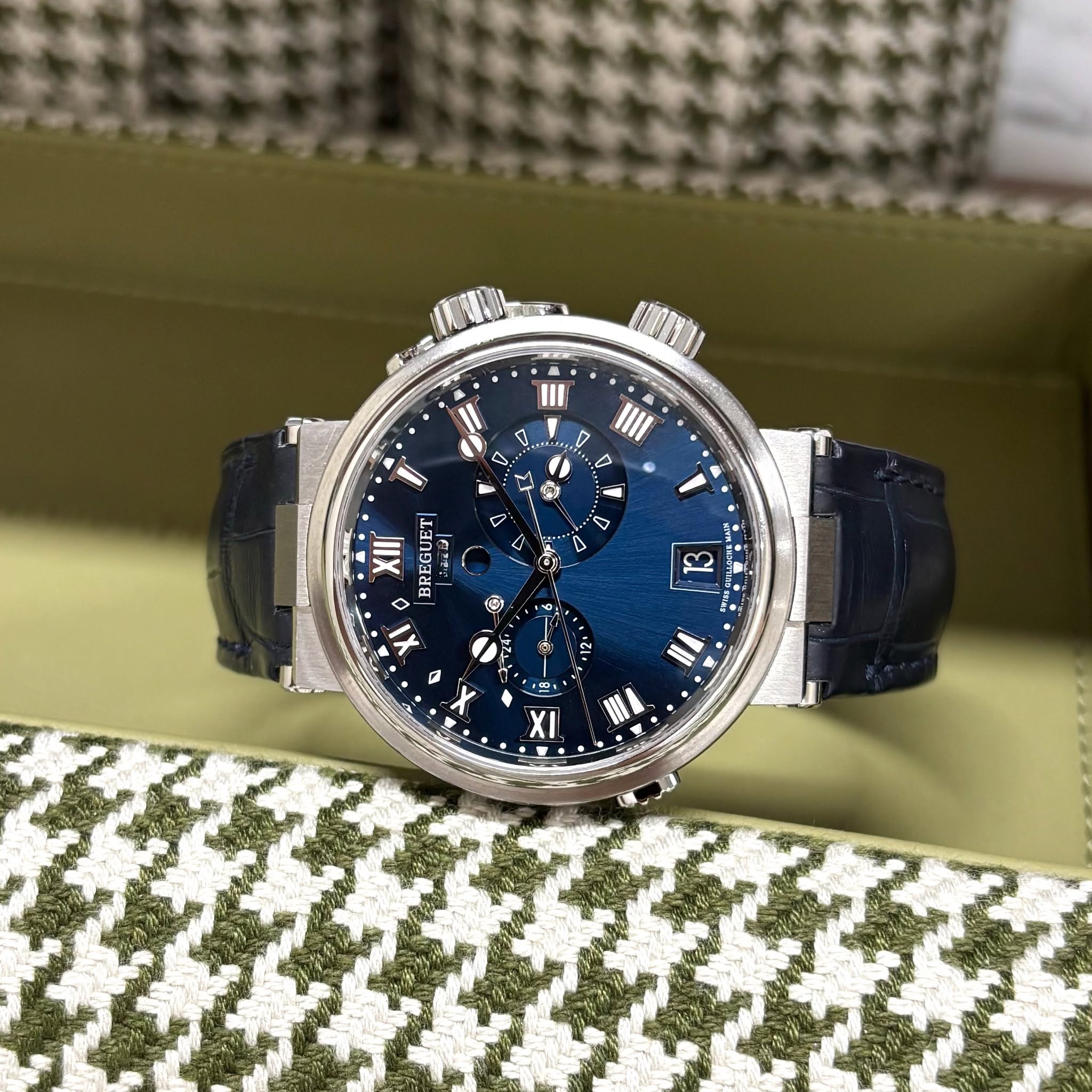 May be an image of wrist watch and text