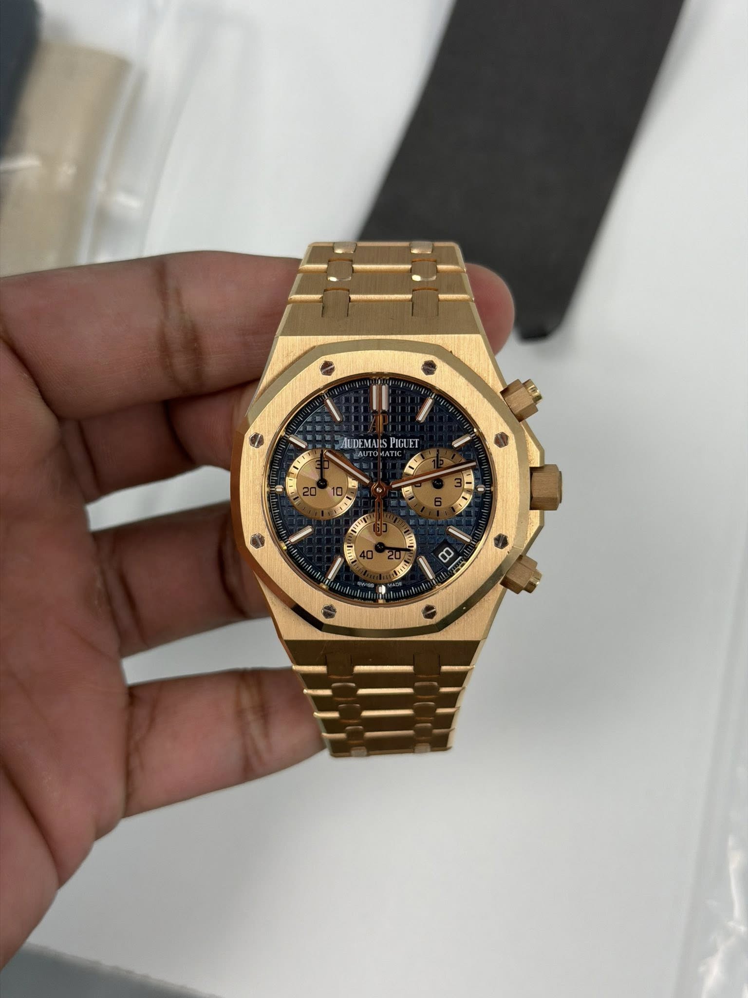 May be an image of wrist watch and text
