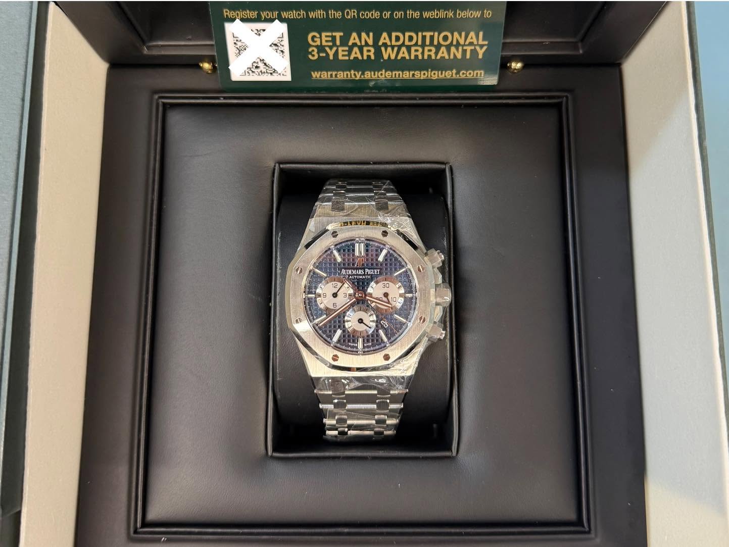 May be an image of wrist watch and text that says 'Register your watch with he QR code the weblink below to لب_وی GET AN ADDITIONAL 3-YEAR WARRANTY warranty.audemarsplguet.com 1…