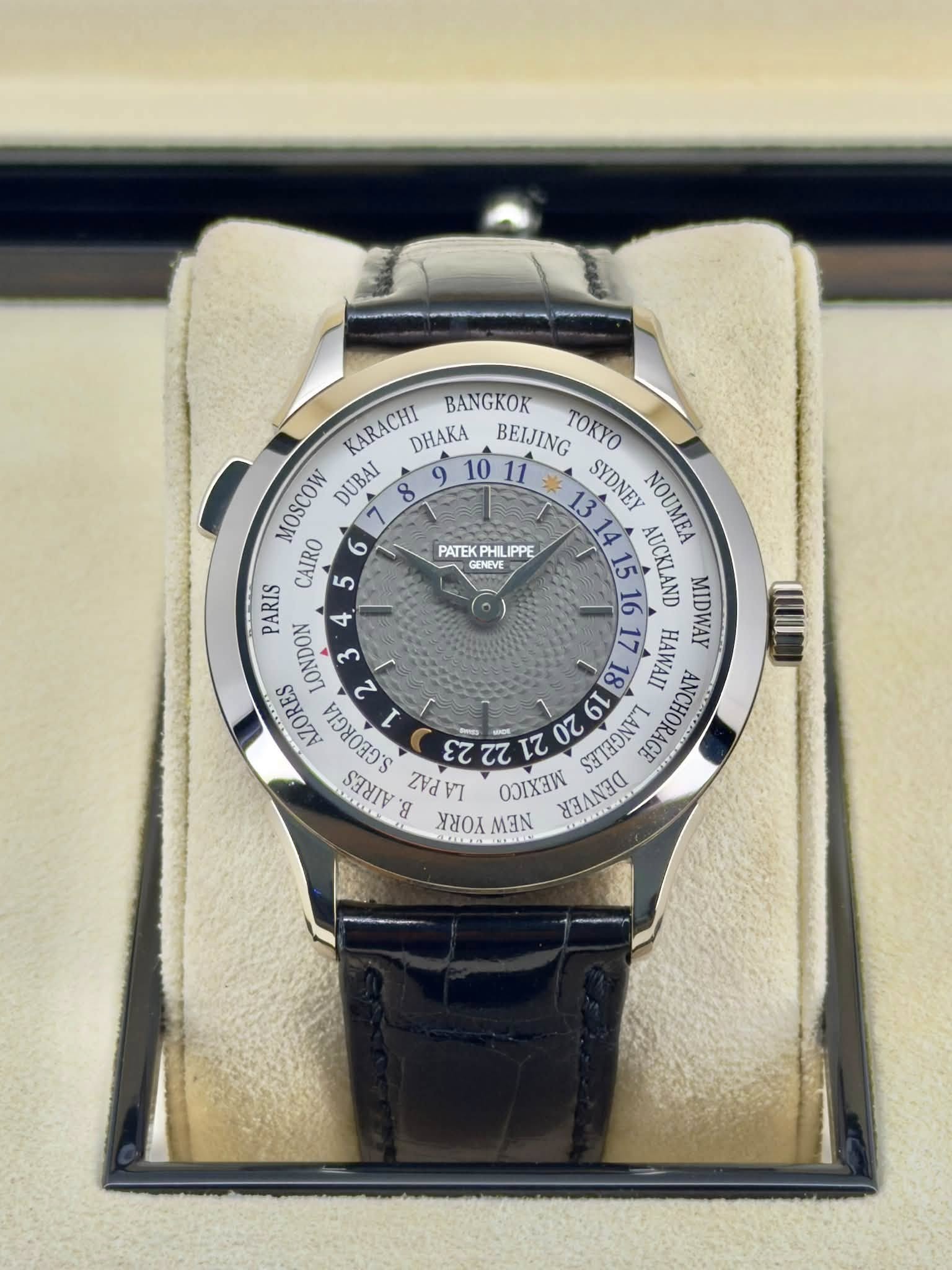 May be an image of wrist watch and text that says 'PATEK PHILIPPE PHIL LIPPE GENEVE KARACHI DHAKA BANGKOK BEIJING TOK MOSCOW DUBAI SYDNEY NOUMEA CAIRO 5 15 AUCKLAND 일 1II PARIS…