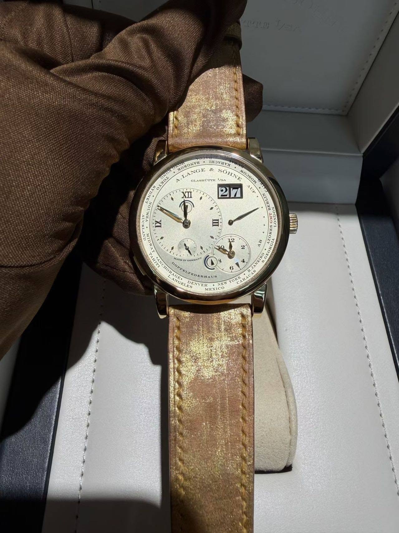 May be an image of wrist watch and text