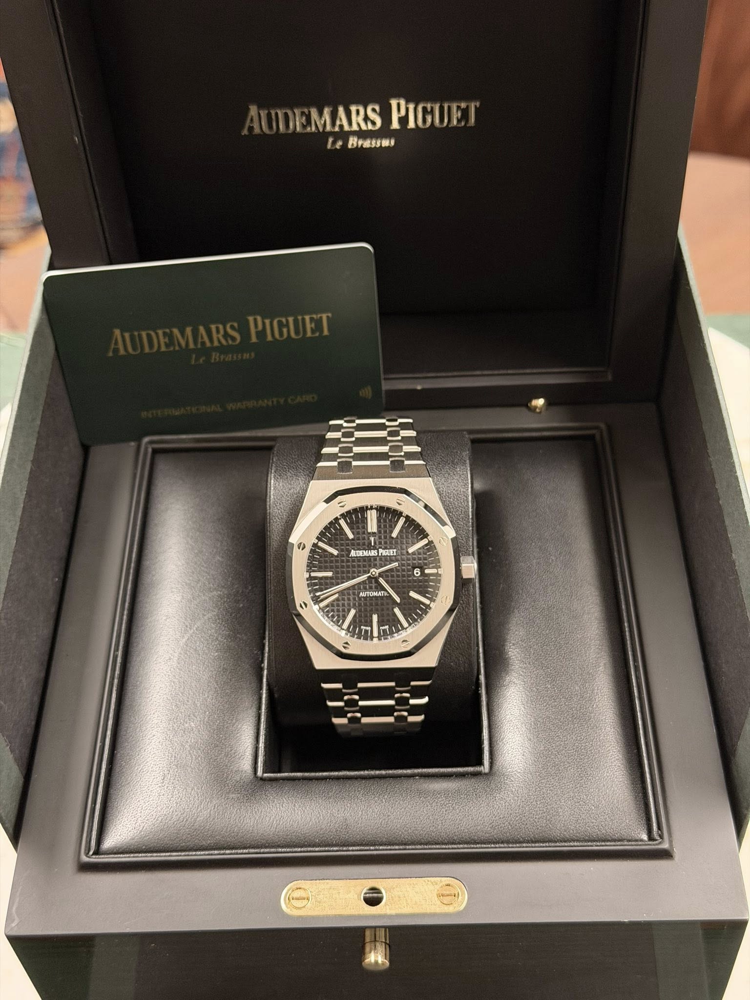 May be an image of wrist watch and text