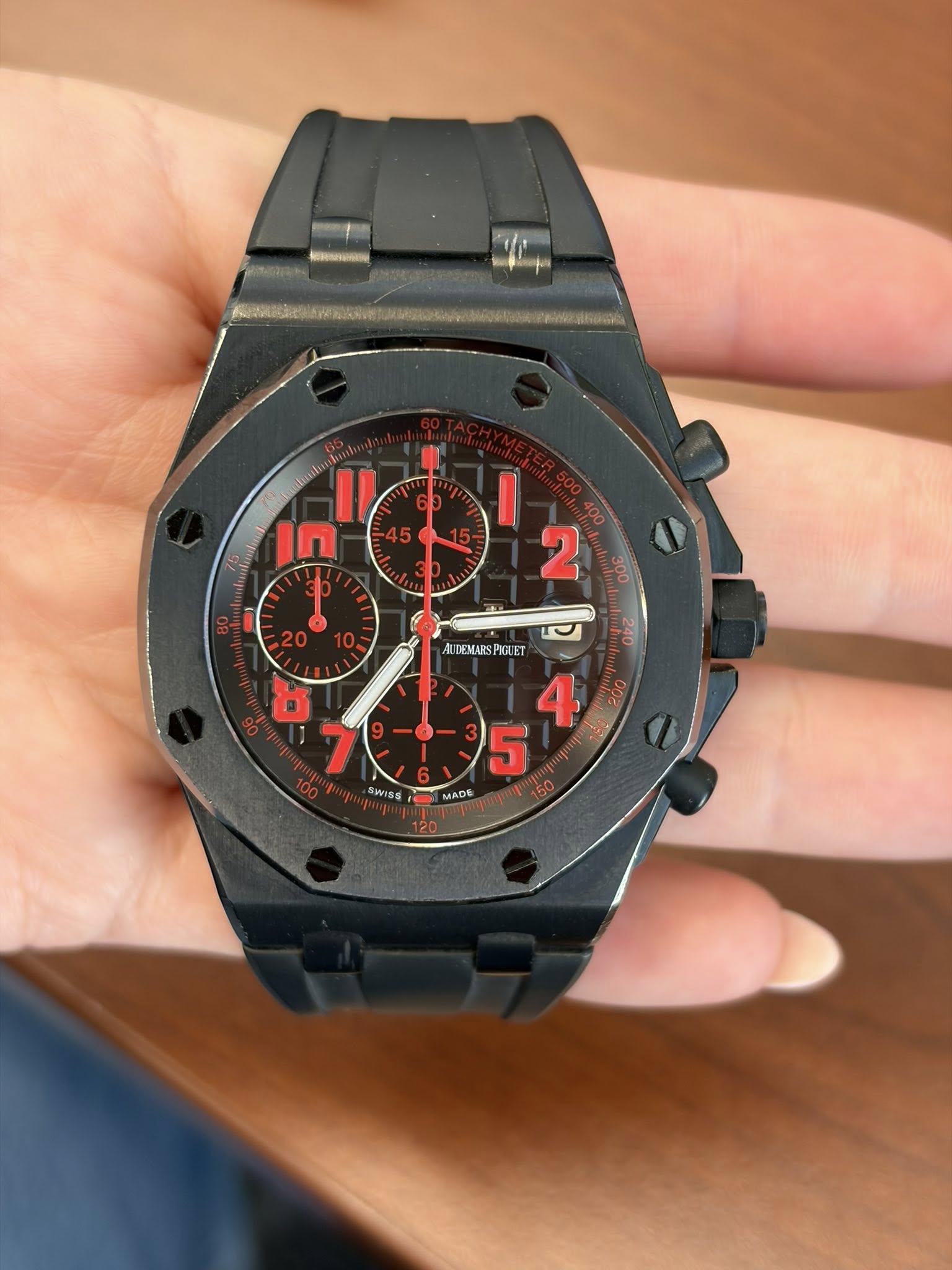 May be an image of wrist watch and text