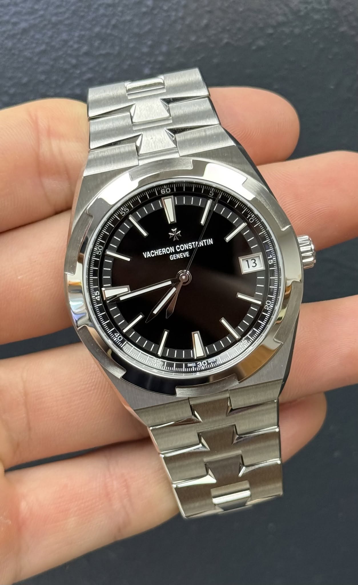 May be an image of wrist watch and text