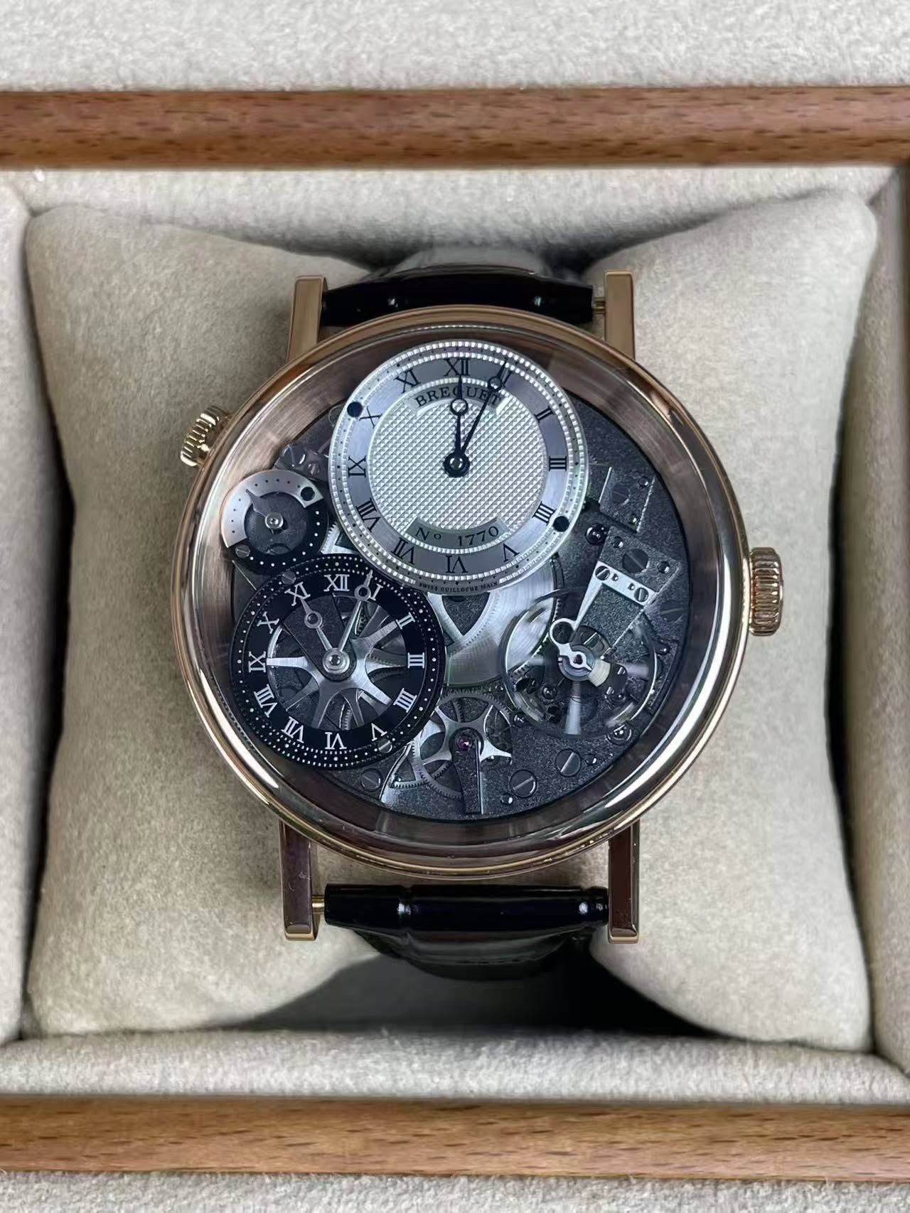 May be an image of wrist watch and text that says 'HETVHN (בחוופיים (+) III XII AD ብ 白 III DX VII TIN IA'