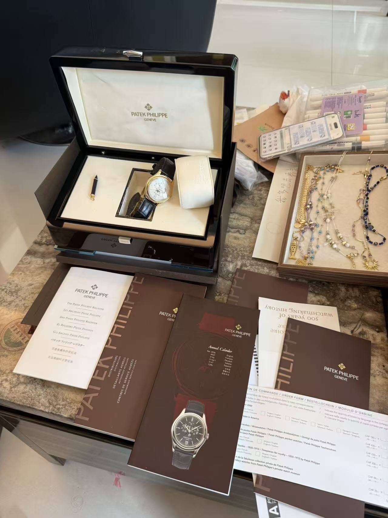 May be an image of wrist watch, jewelry and text
