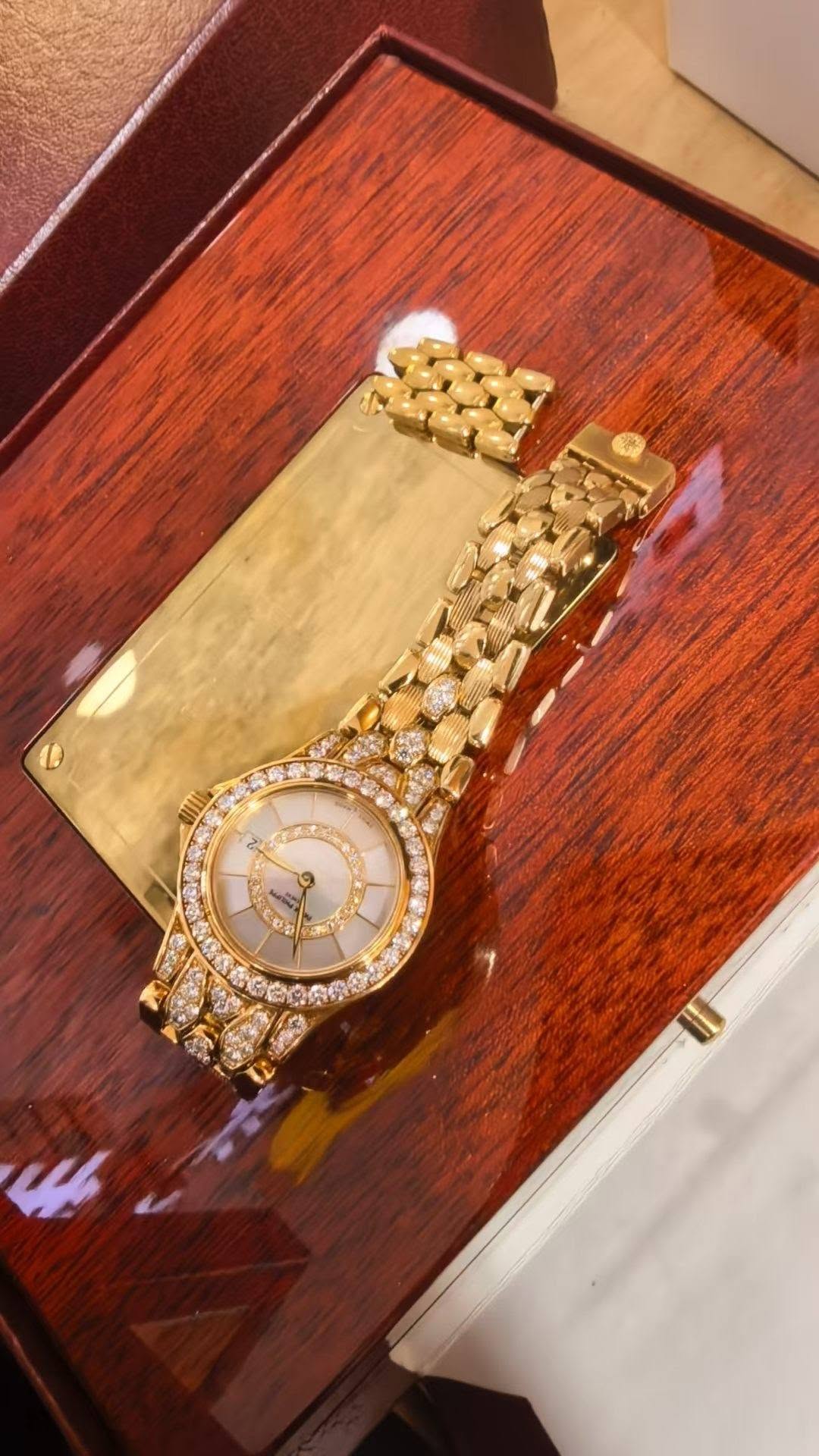 May be an image of wrist watch and text
