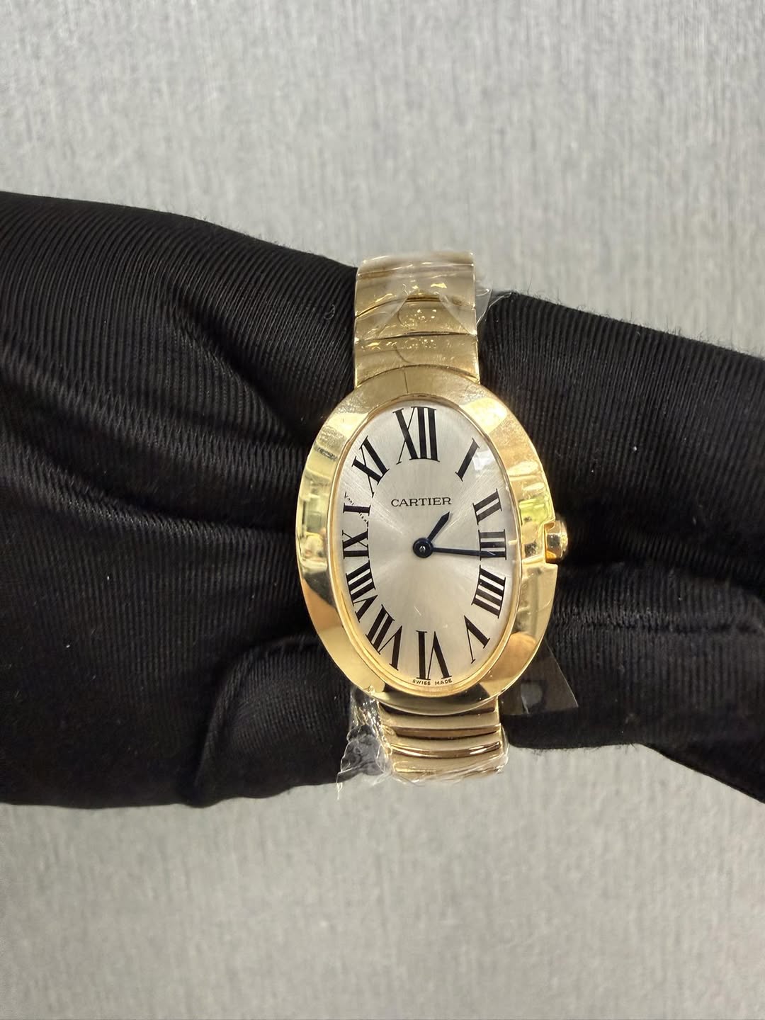 May be an image of wrist watch and text that says 'XI XII I CARTIER IER CARTIE MIIVIIAX NII'