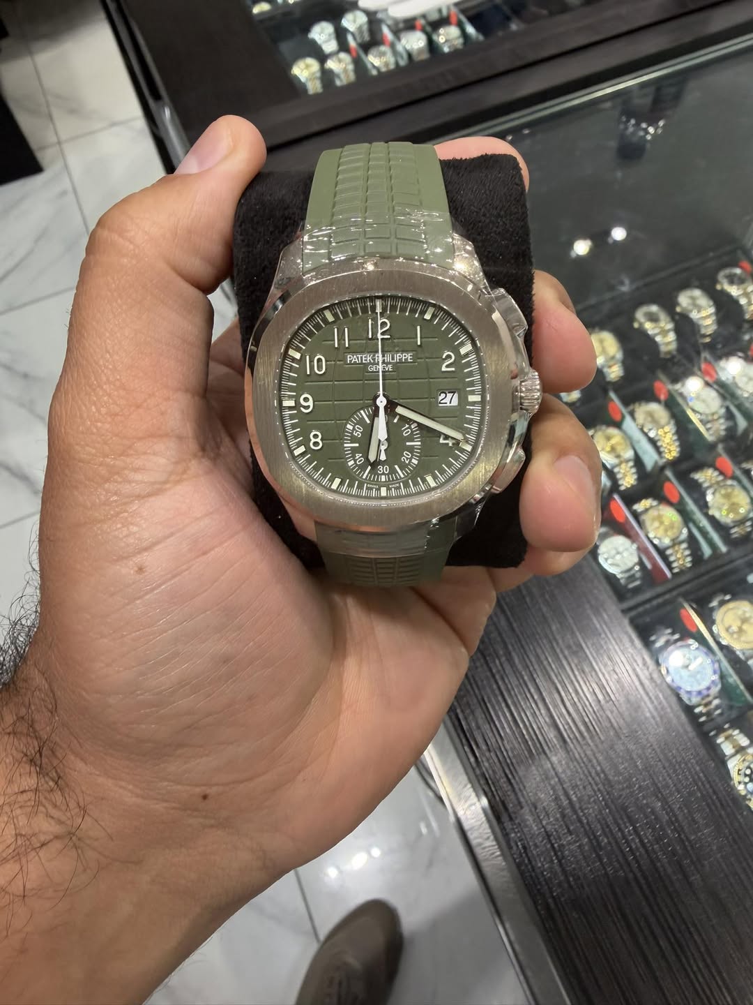 May be an image of wrist watch and text