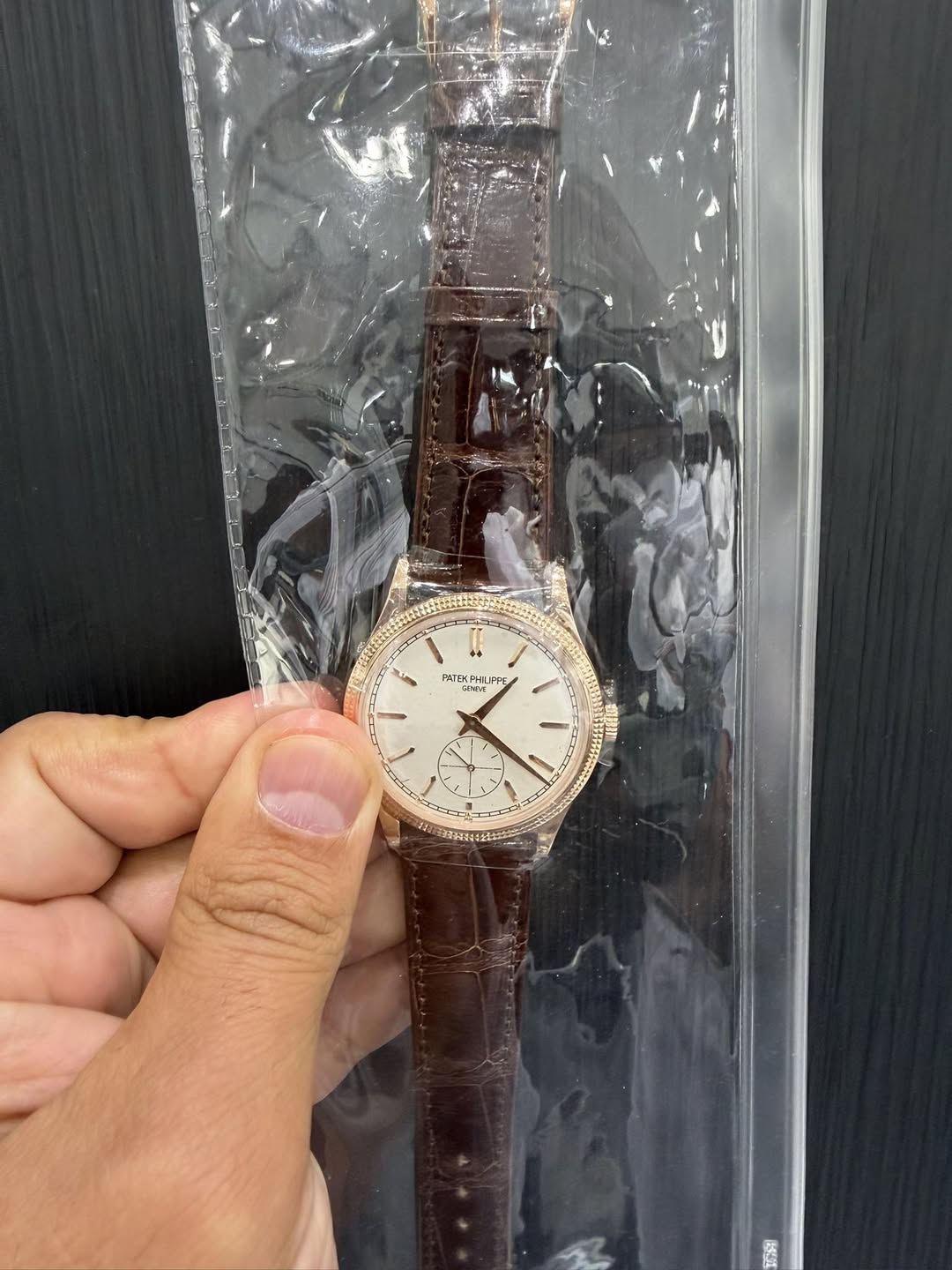 May be an image of wrist watch and text