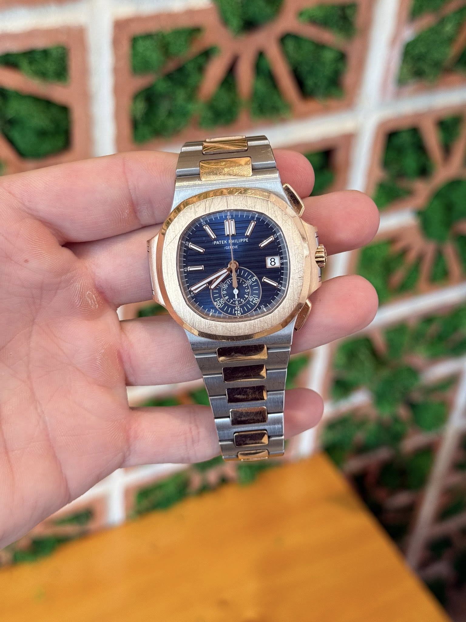 May be an image of wrist watch and text