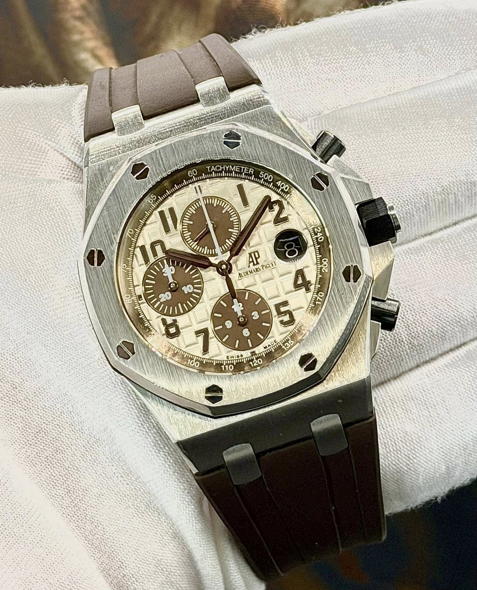 May be an image of wrist watch and text
