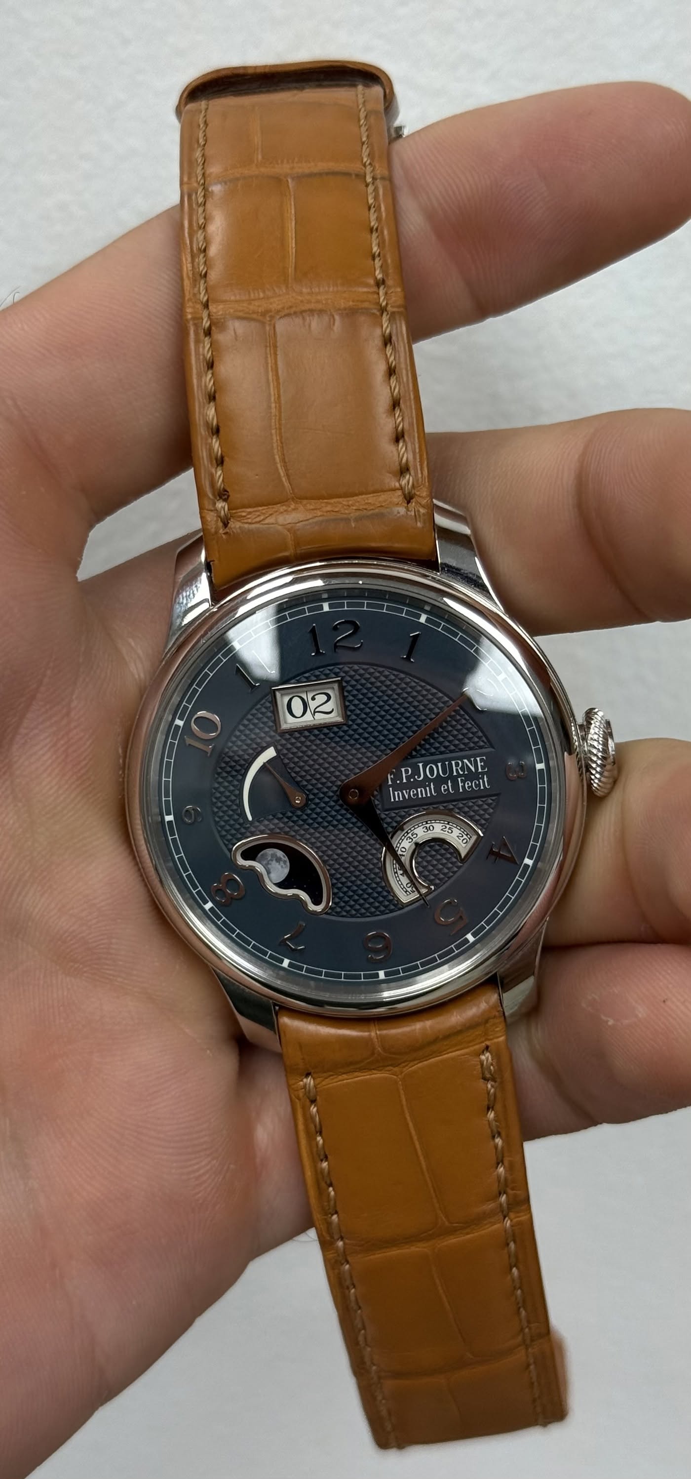 May be an image of wrist watch and text