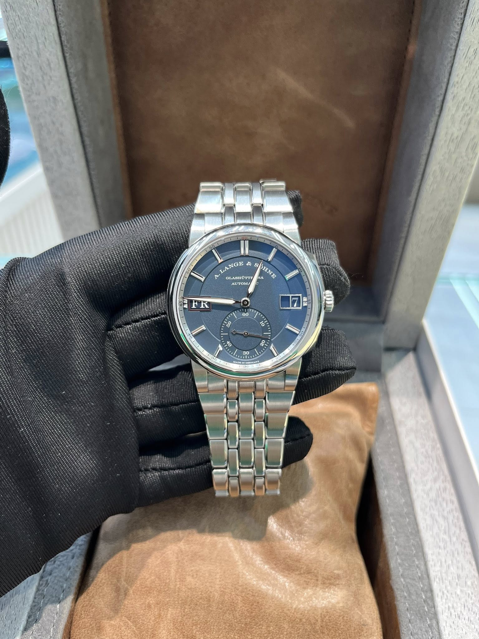 May be an image of wrist watch and text