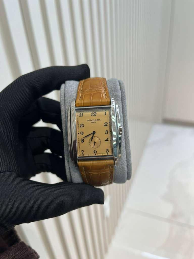 May be an image of wrist watch and text