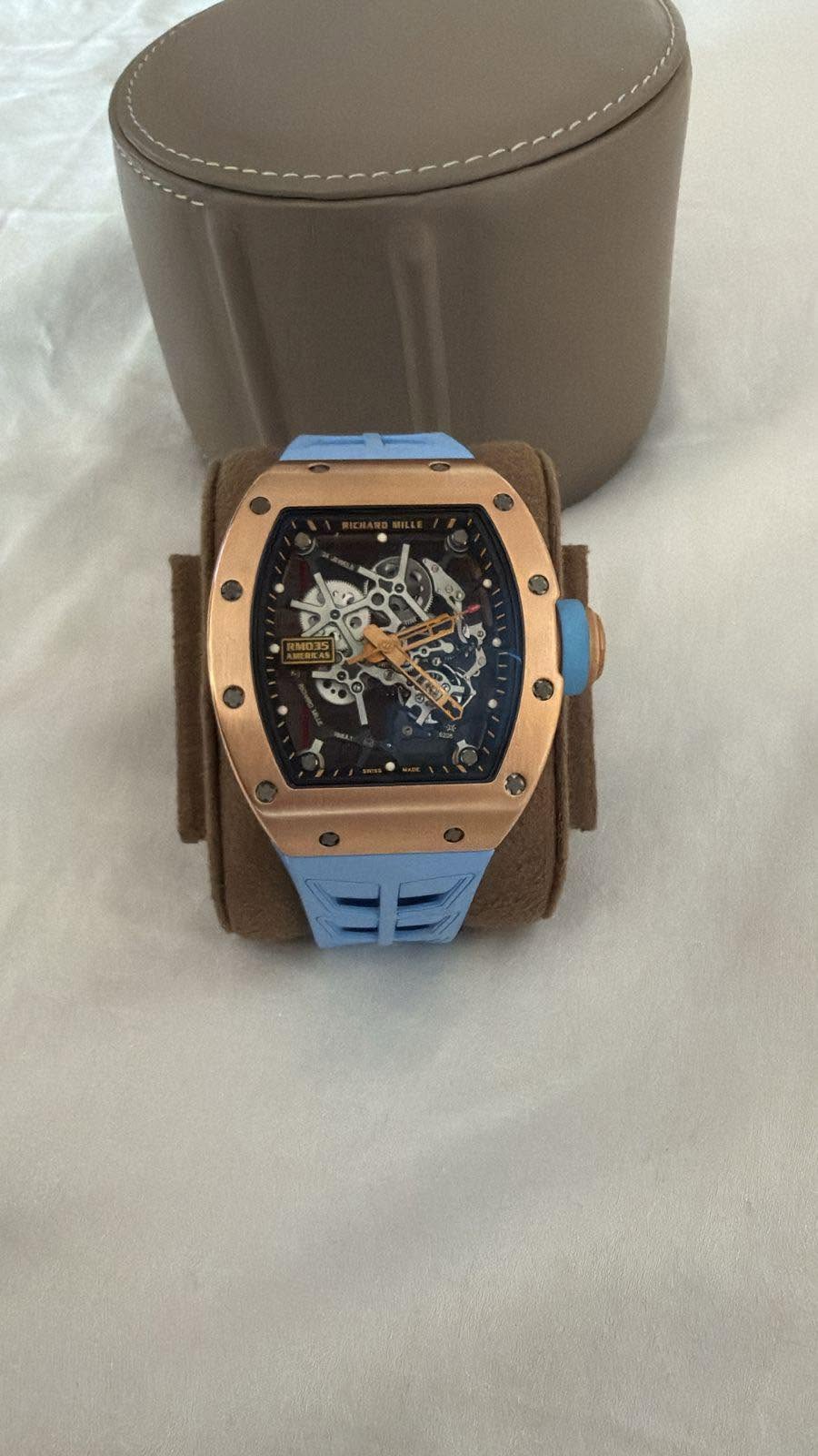 May be an image of wrist watch and text
