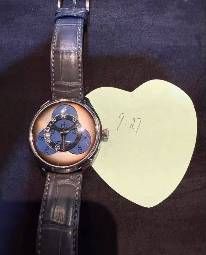May be an image of wrist watch and text