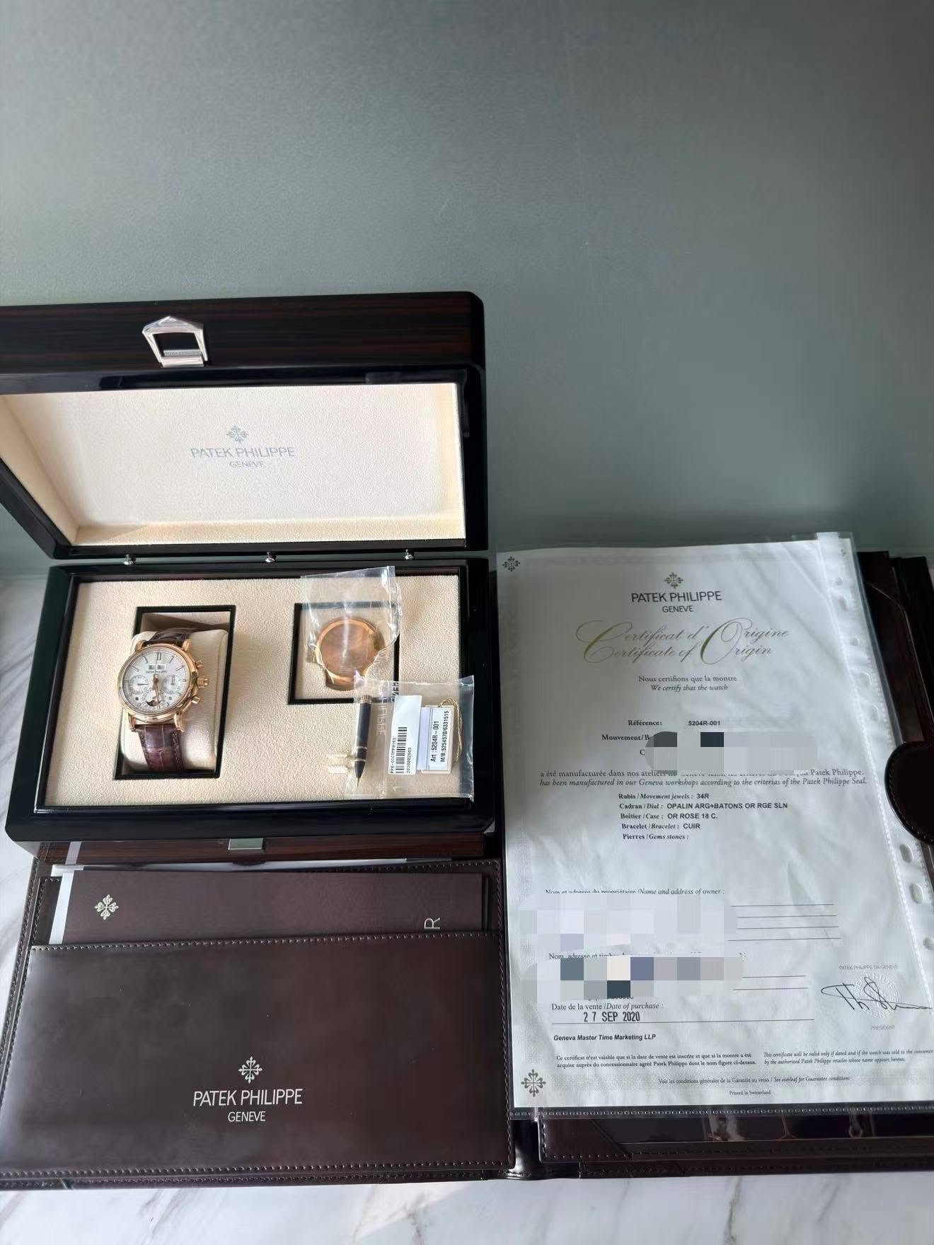 May be an image of wrist watch, suitcase and text