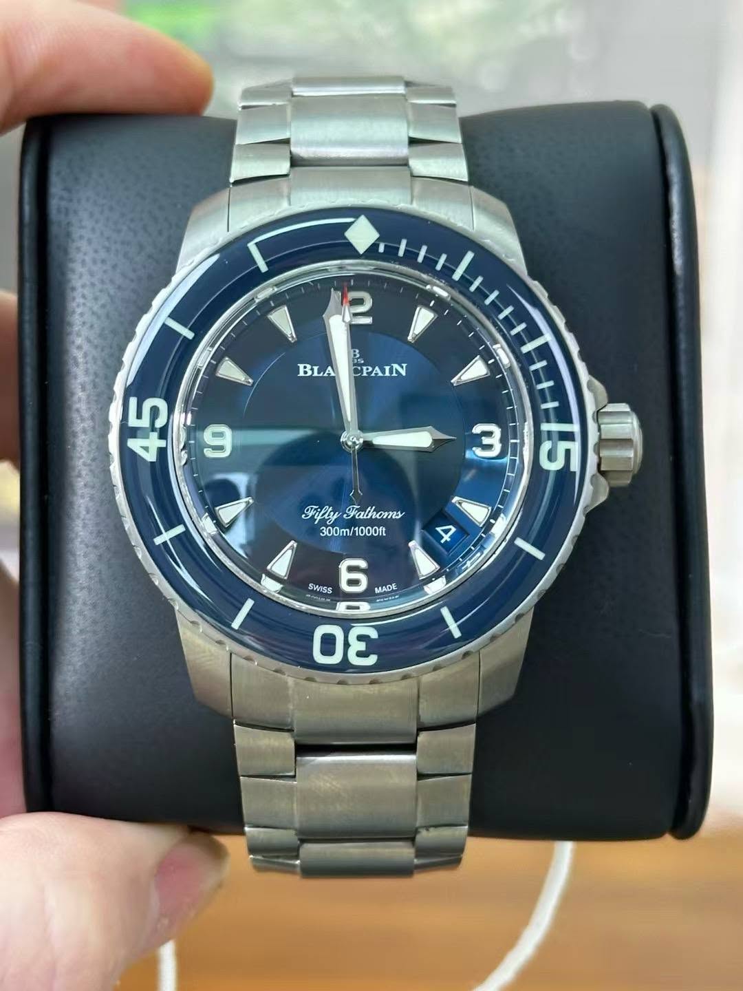 May be an image of digital watch and text that says '2 BLACPAIN PAIN BLA 45 co 3 FiftyFathoms Fifly Fathoms 300m/1000ft 1000ft SWISS 6 AAΕ M'