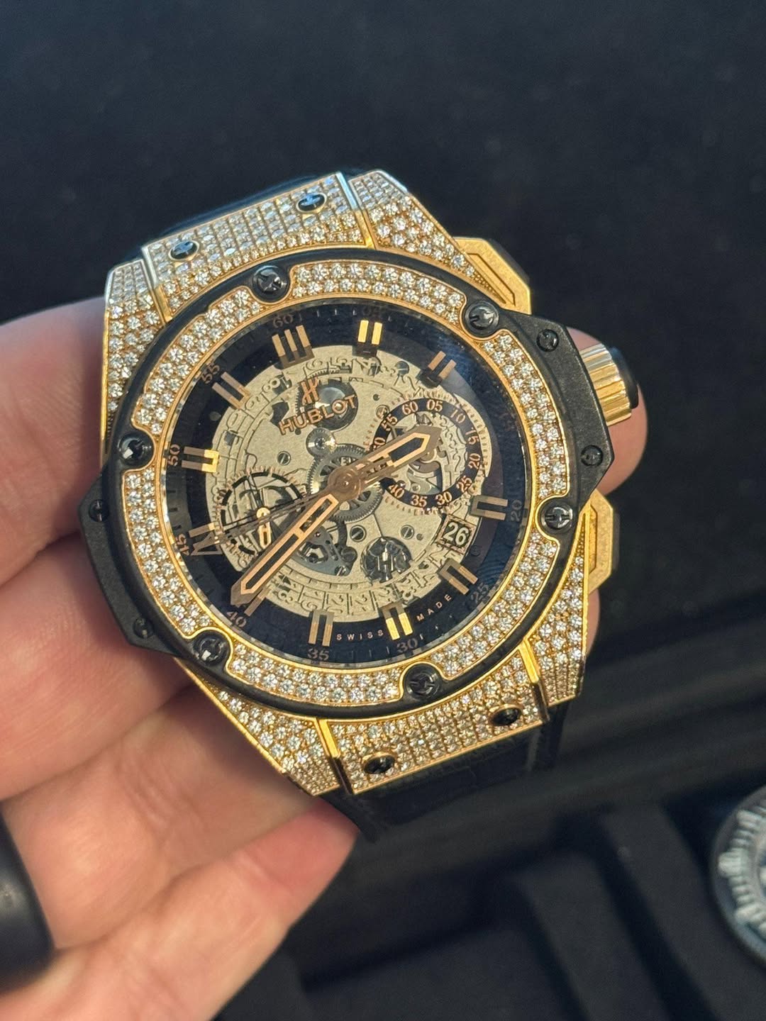 May be an image of wrist watch and text
