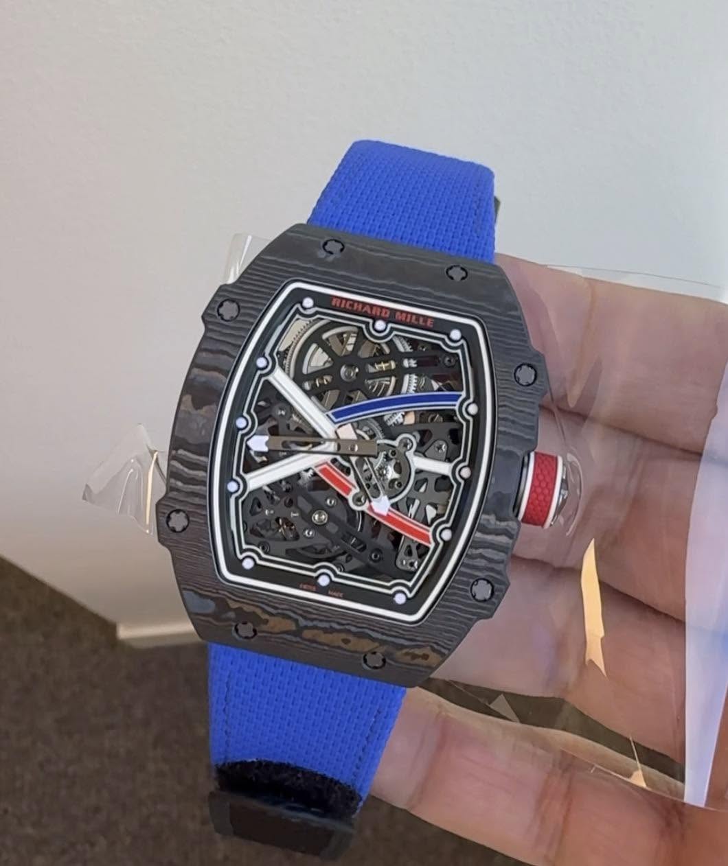 May be an image of wrist watch and text