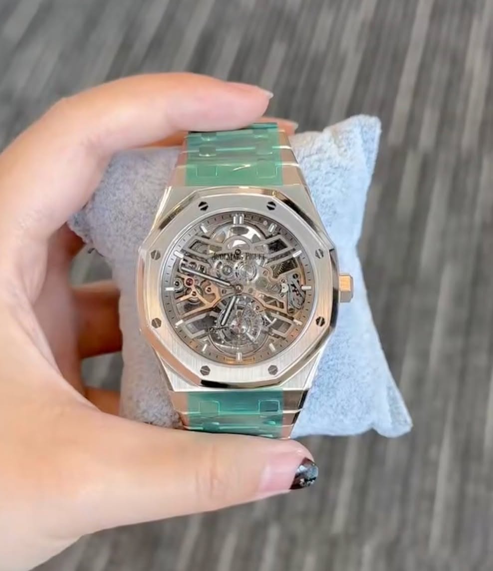 May be an image of wrist watch and text