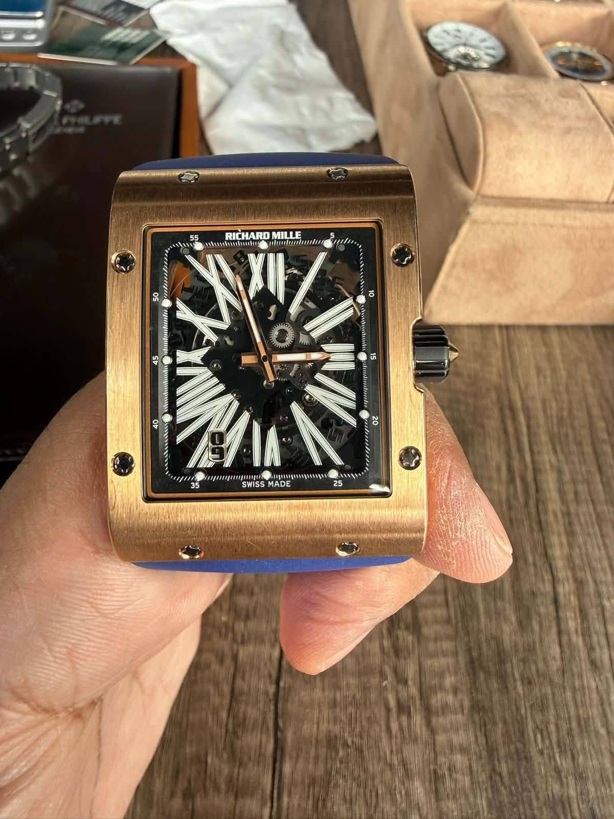 May be an image of wrist watch and text