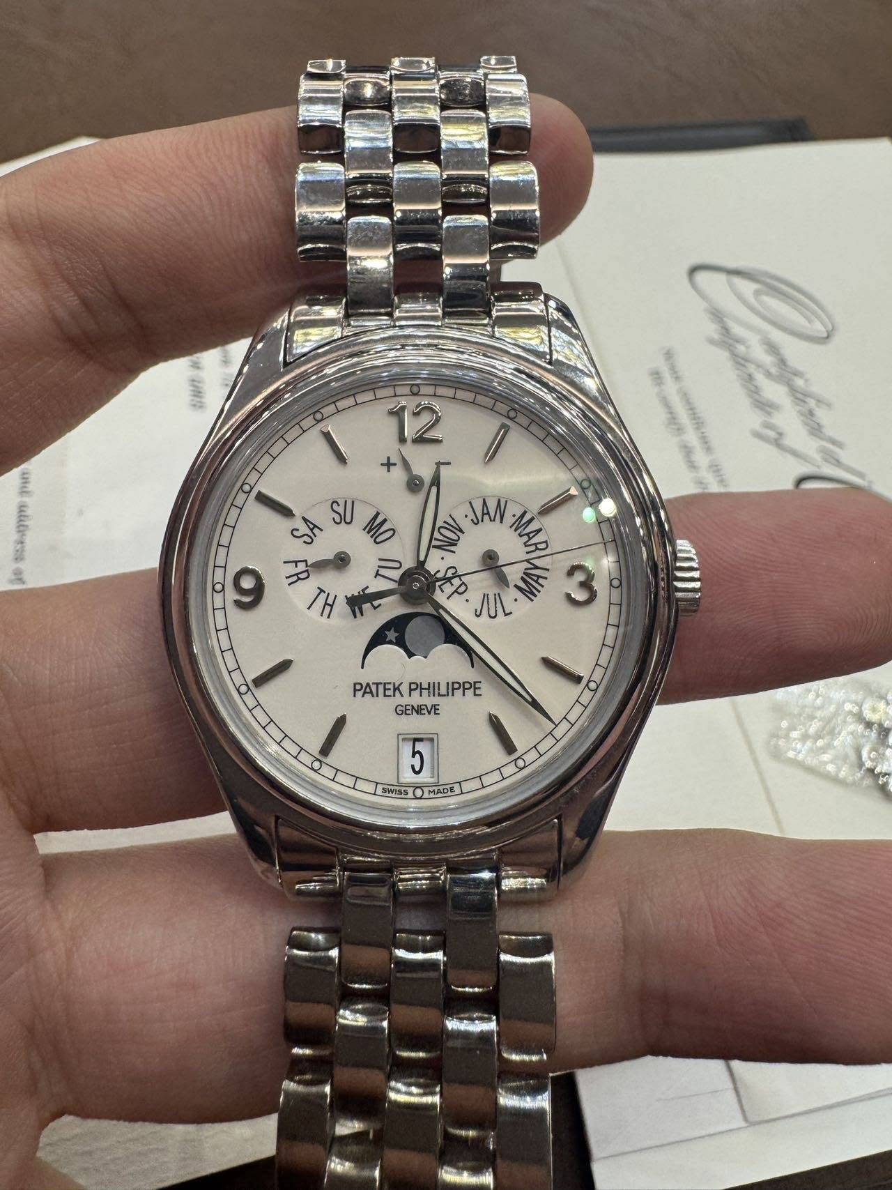May be an image of wrist watch and text
