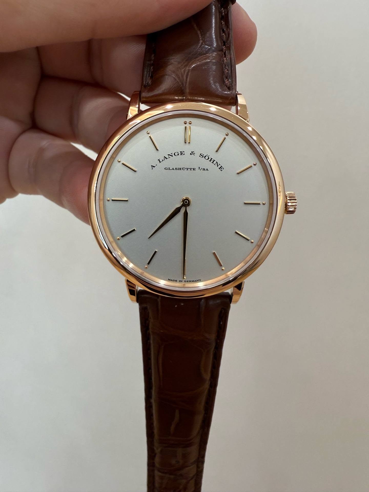 May be an image of wrist watch and text