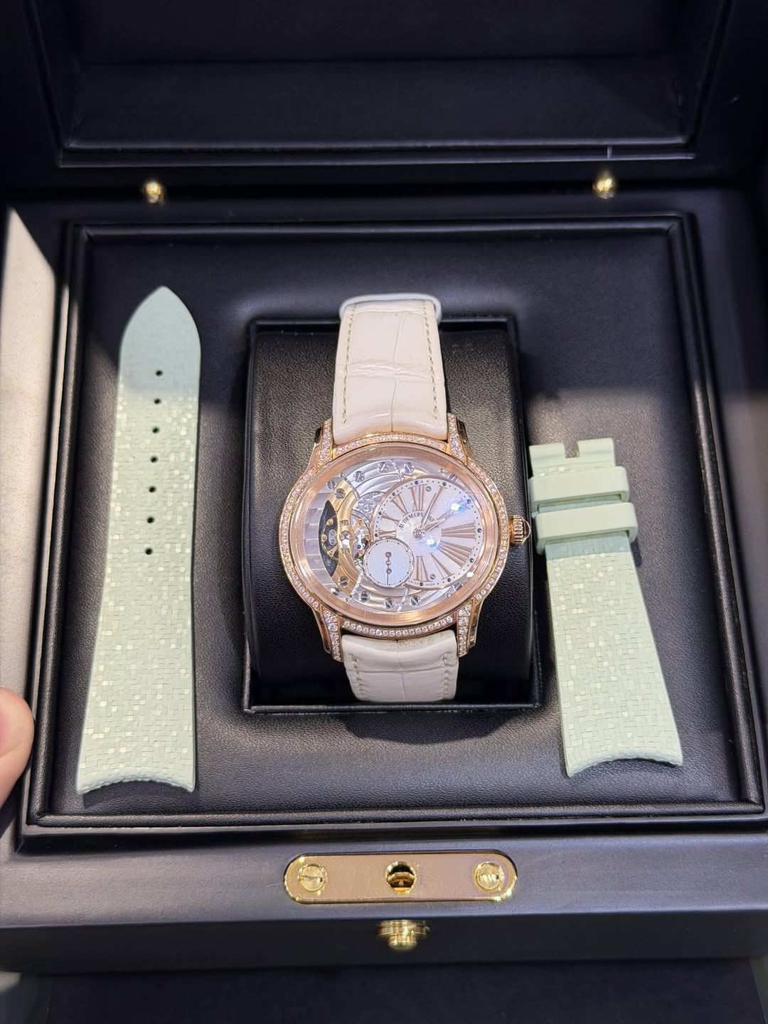 May be an image of wrist watch and text
