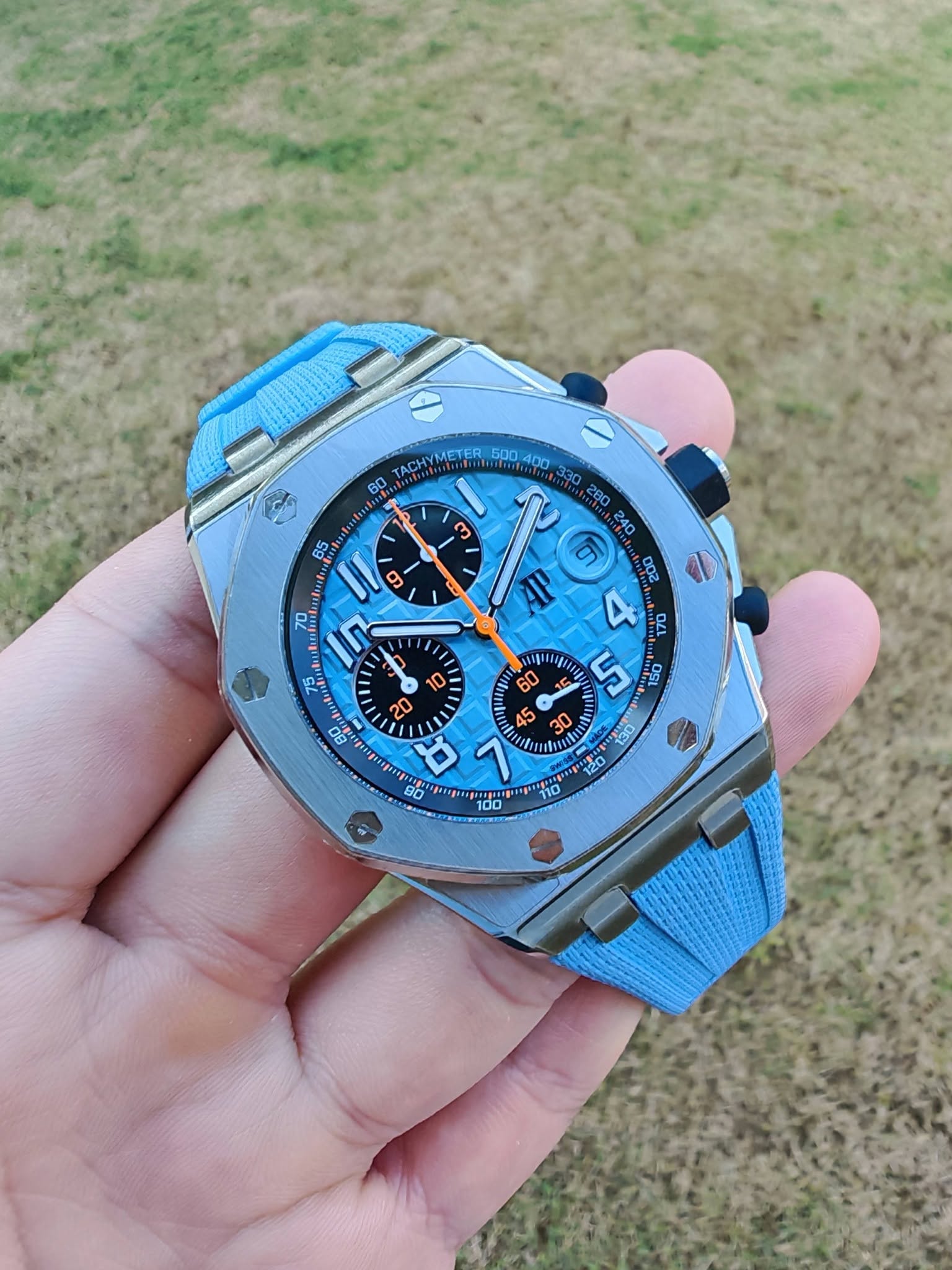 May be an image of wrist watch and text