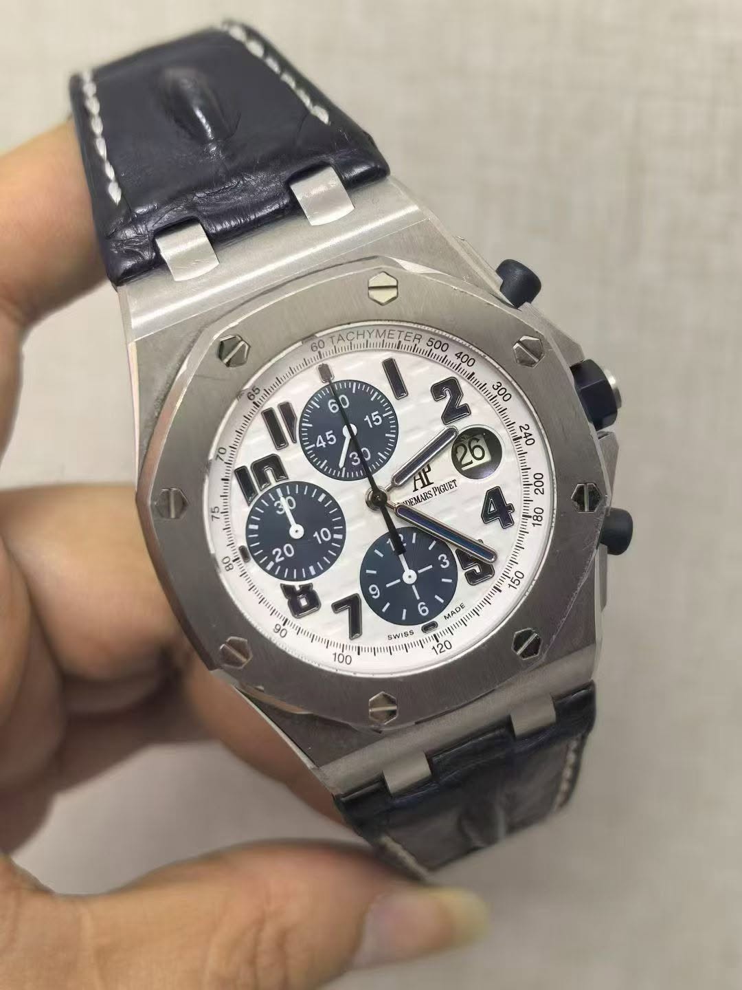May be an image of wrist watch and text
