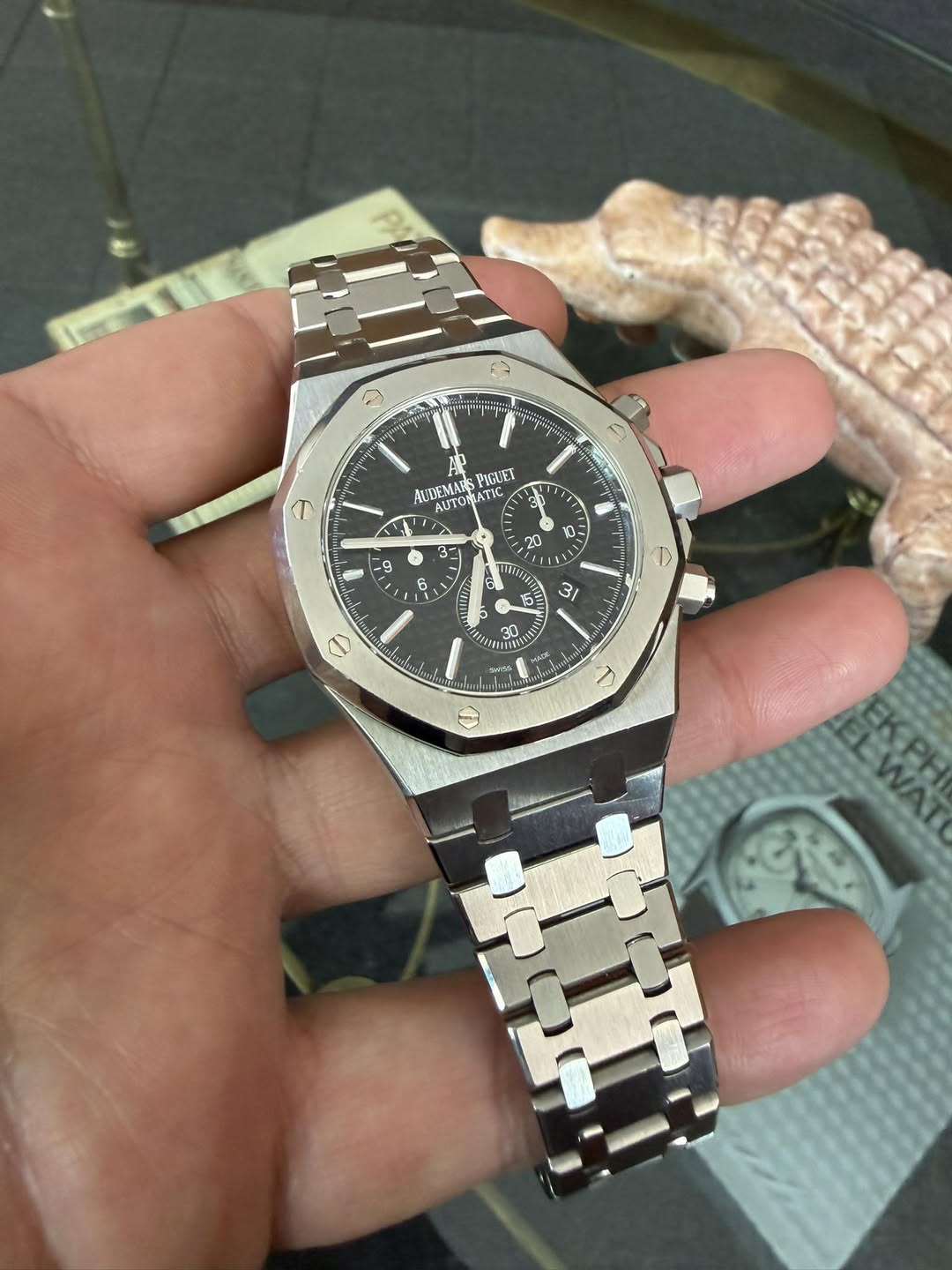 May be an image of wrist watch and text