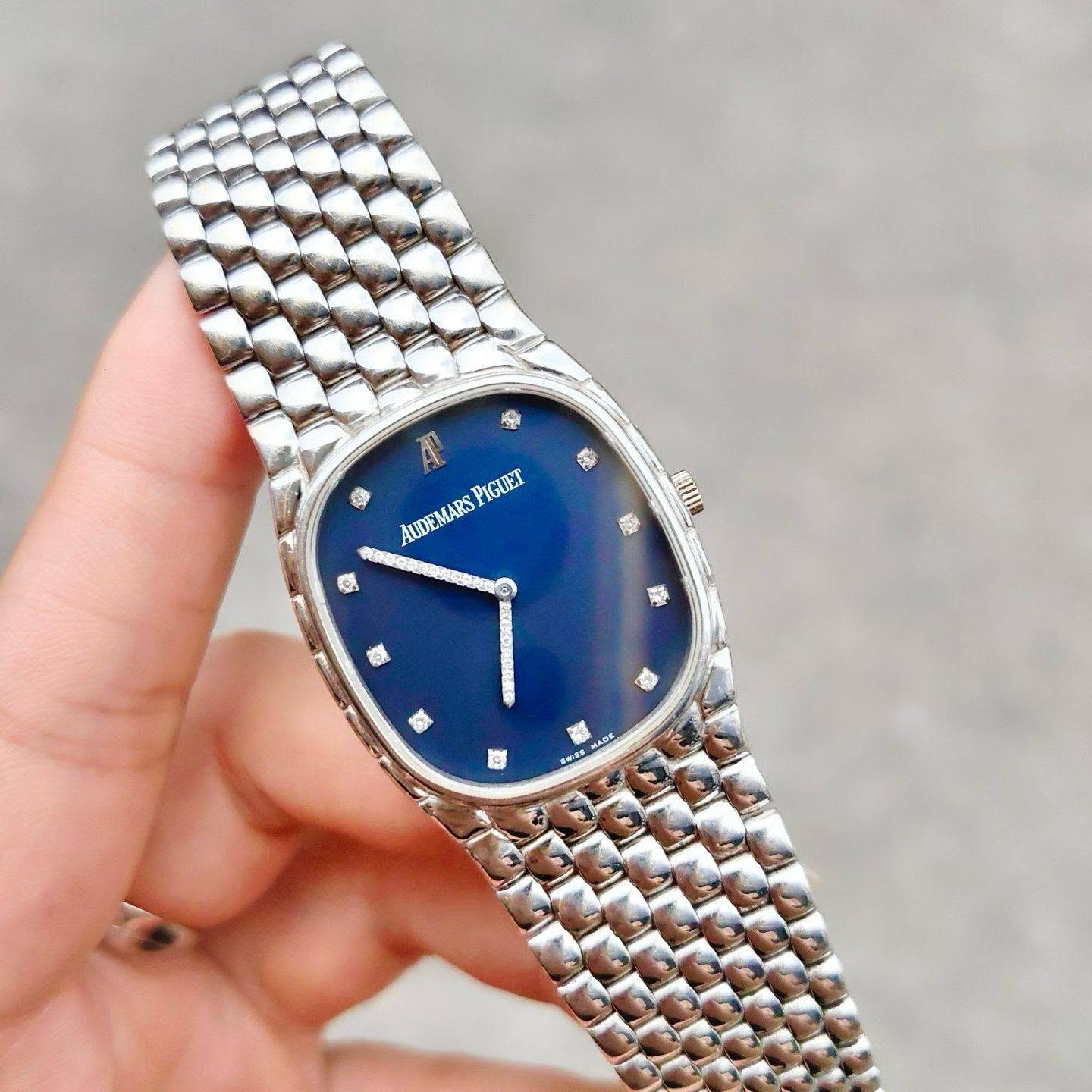 May be an image of wrist watch and text