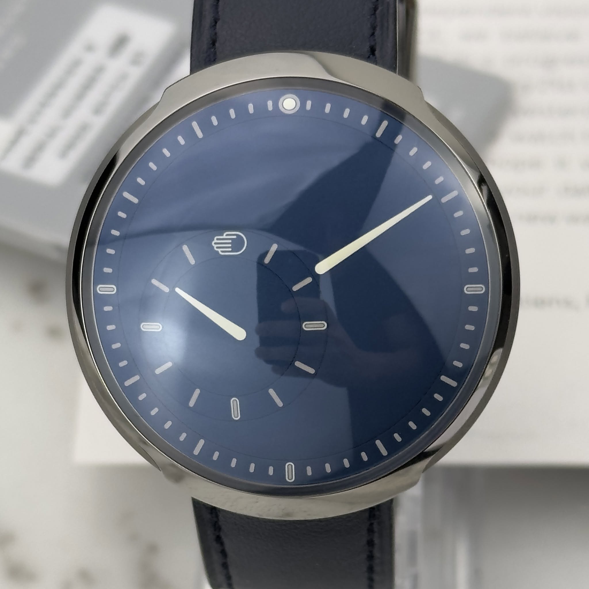 May be an image of wrist watch and text