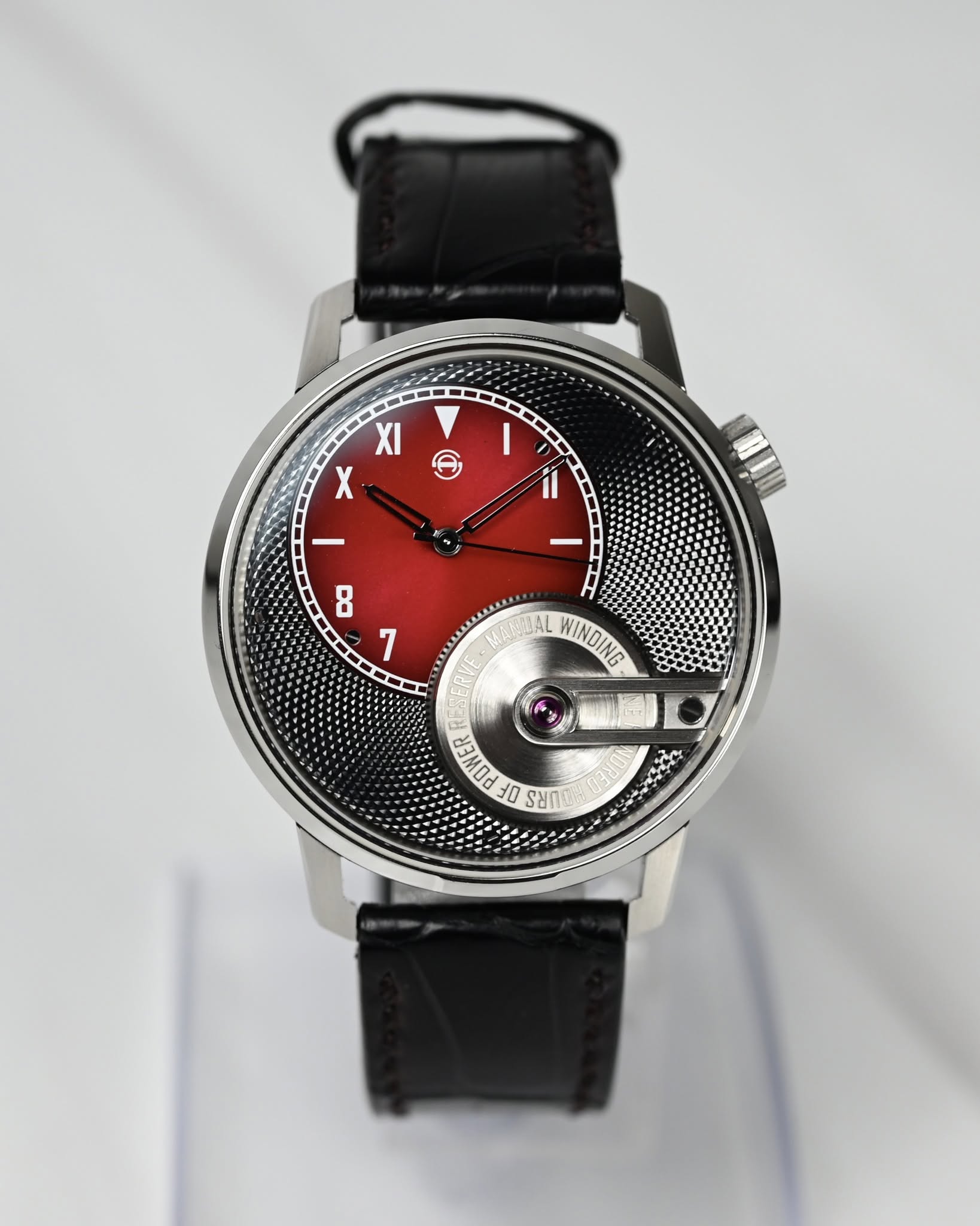 May be an image of wrist watch and text that says 'ت Ι X I 8 1 WINDING POMER 1O החעל'