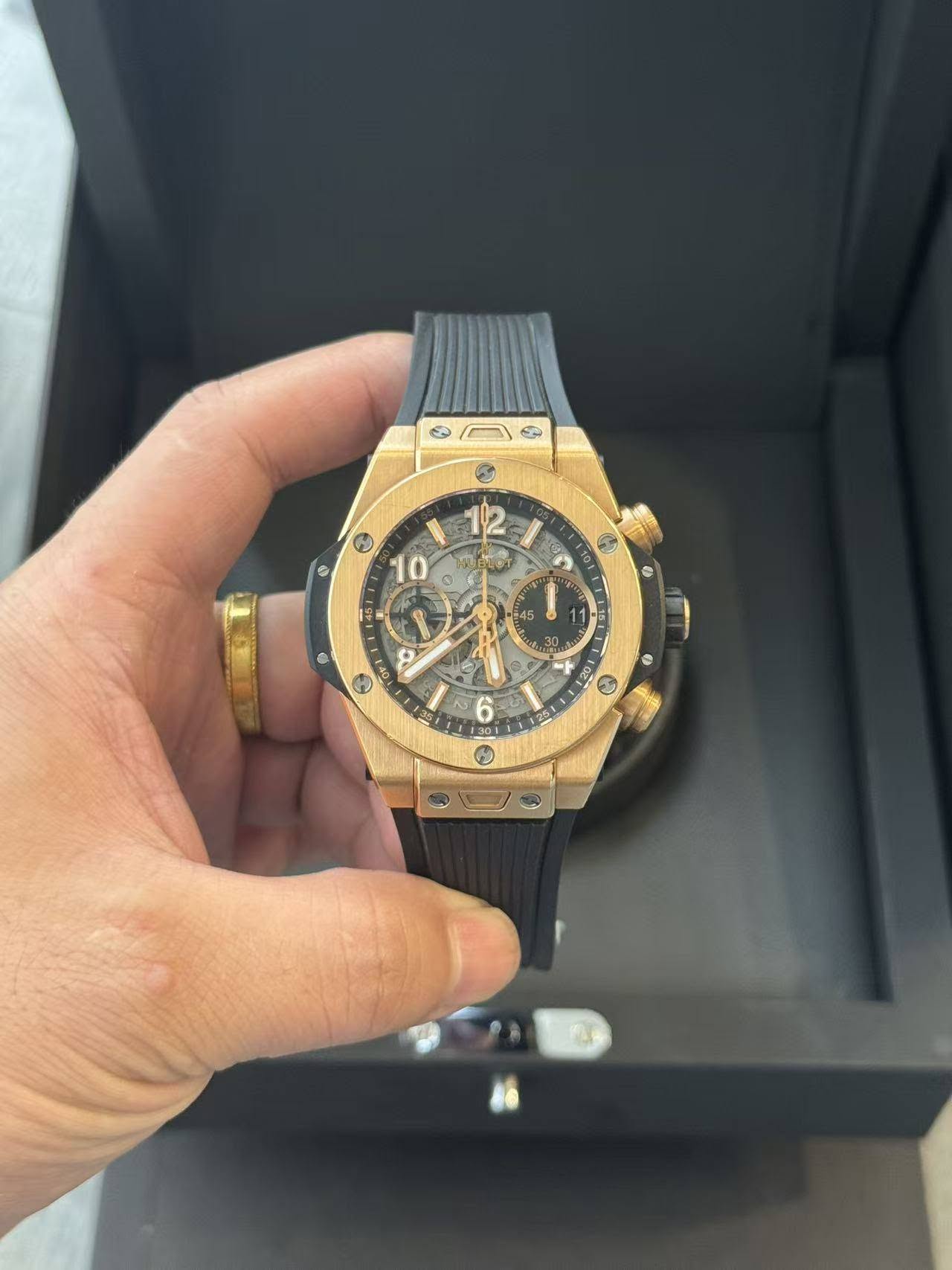 May be an image of wrist watch and text