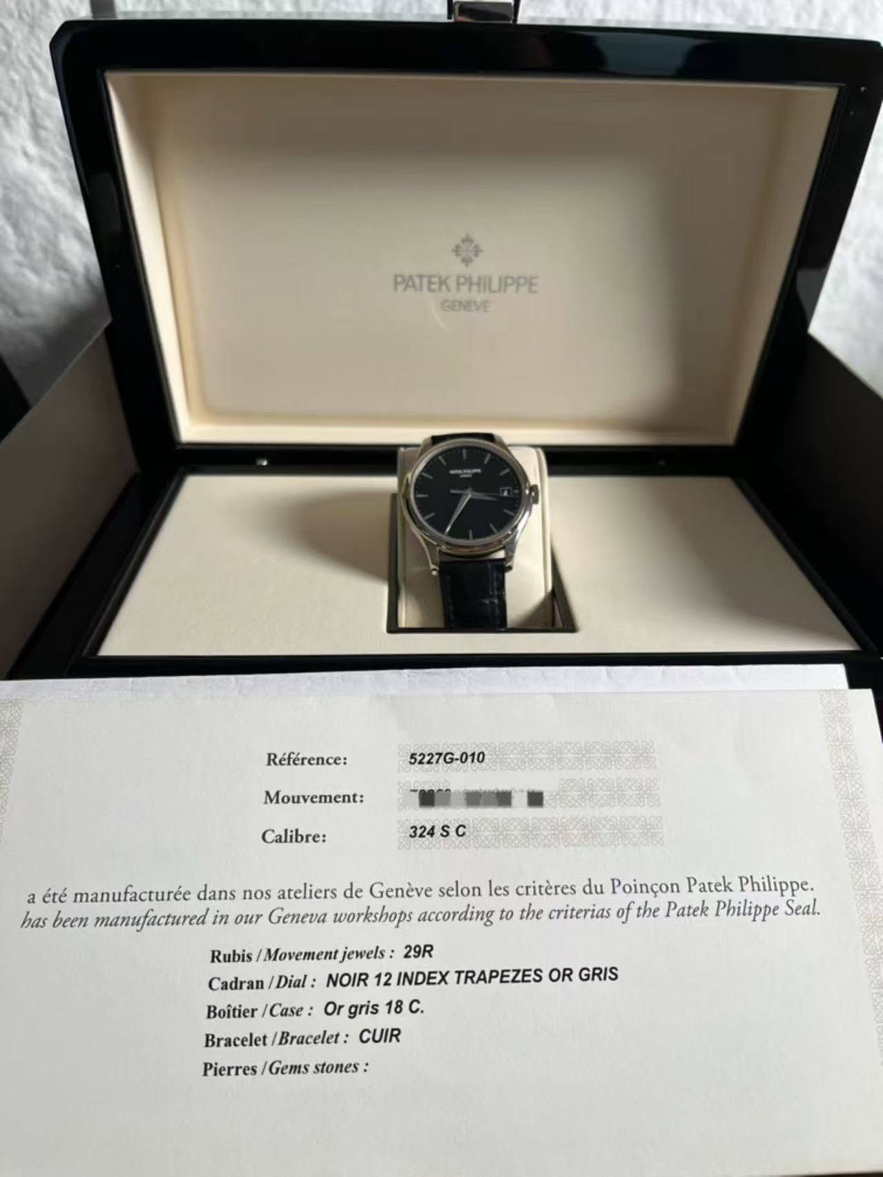 May be an image of wrist watch and text that says 'PATEKPHILIPPE PHILIPPE PATEK GENEVE Référence: 5227G-010 Mouvement: Calibre: 24SC a été manufacturée dans nos ateliers de Genève…