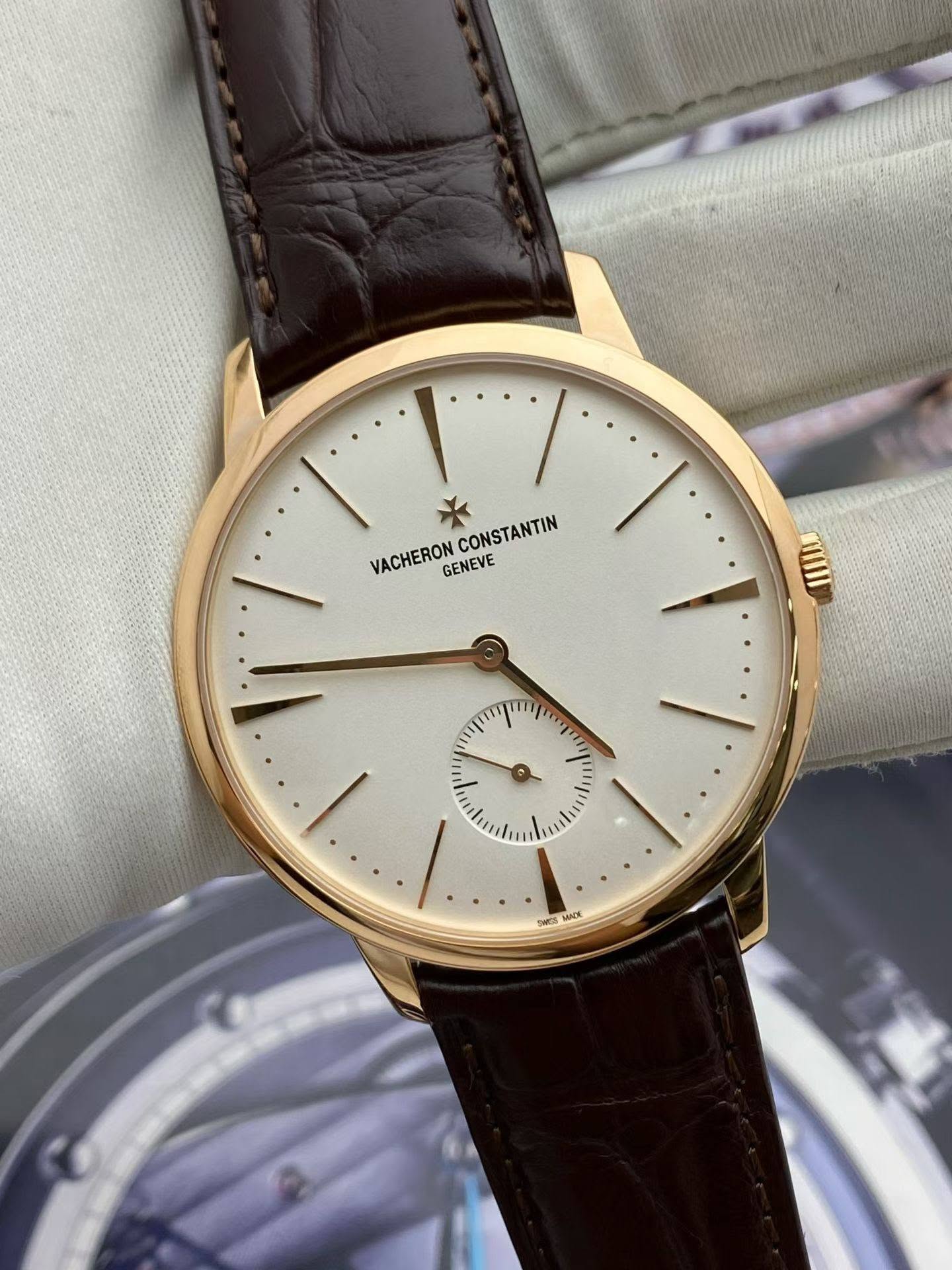 May be an image of wrist watch and text that says 'CONSTANTIN VACHERON GENEVE د MAcK'
